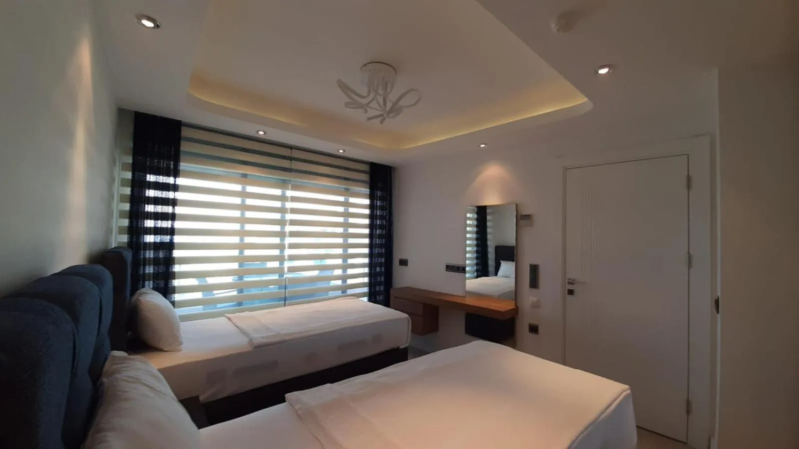 Bed in Elite Luxury Suite & Spa