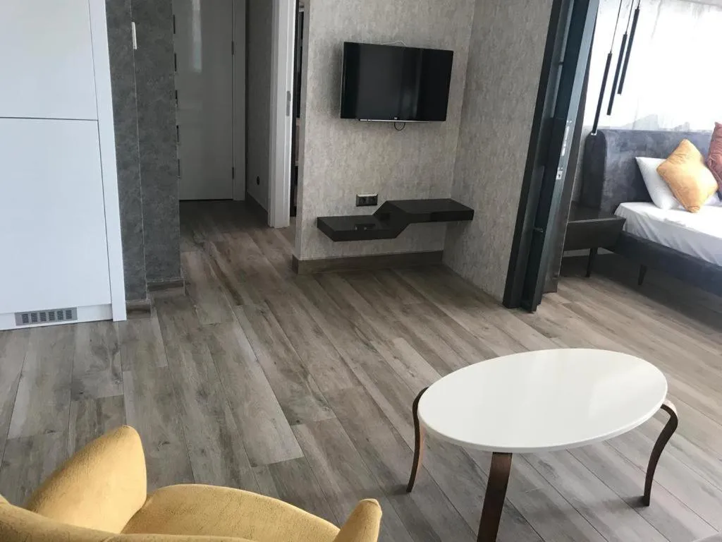 Seating area, Bed in Elite Luxury Suite & Spa