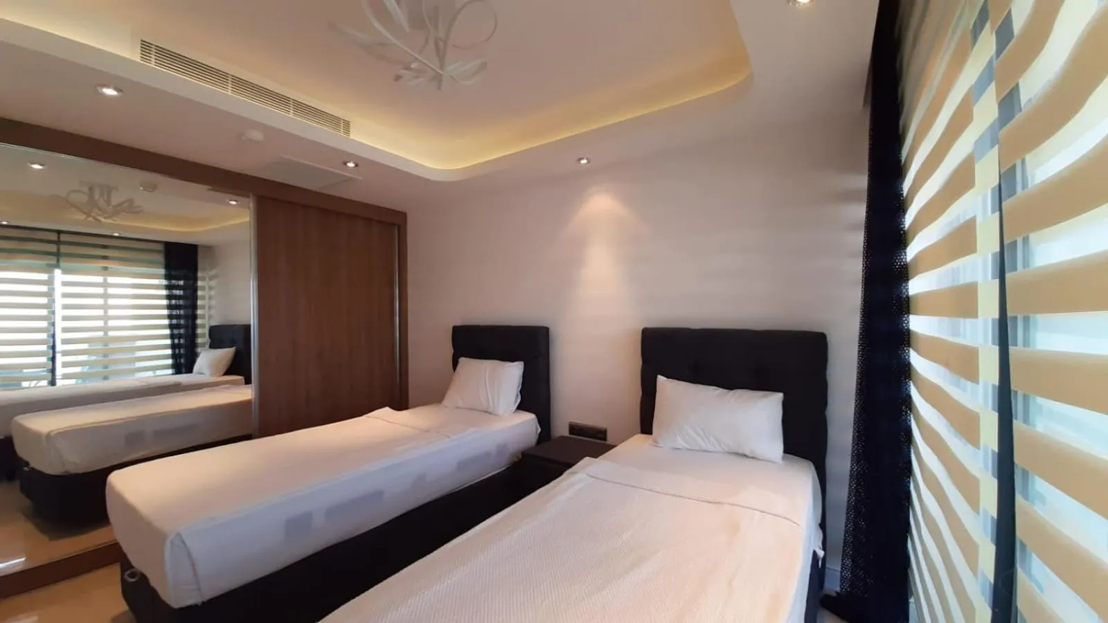 Bed in Elite Luxury Suite & Spa