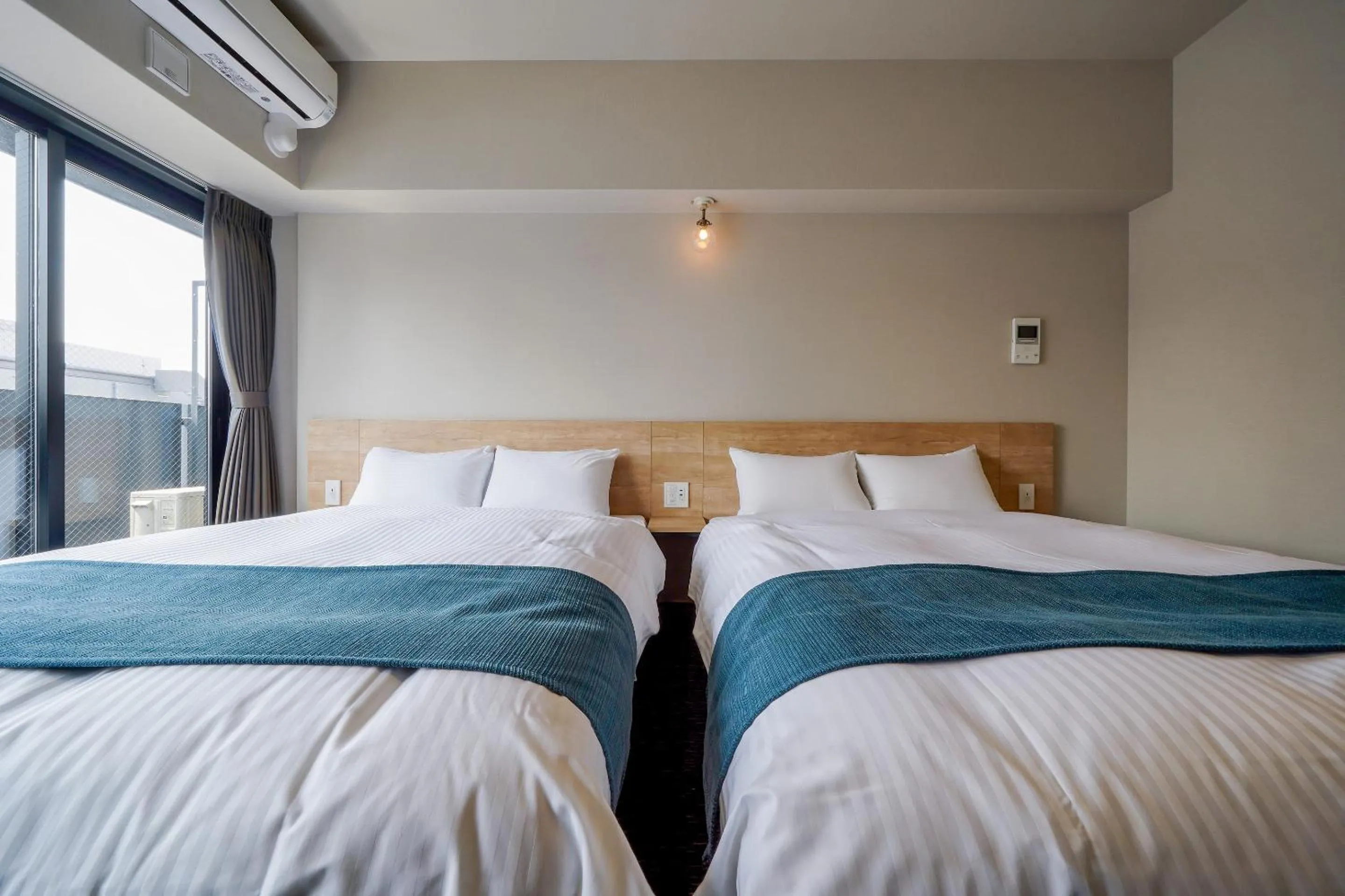 Bed in RESI STAY Heart