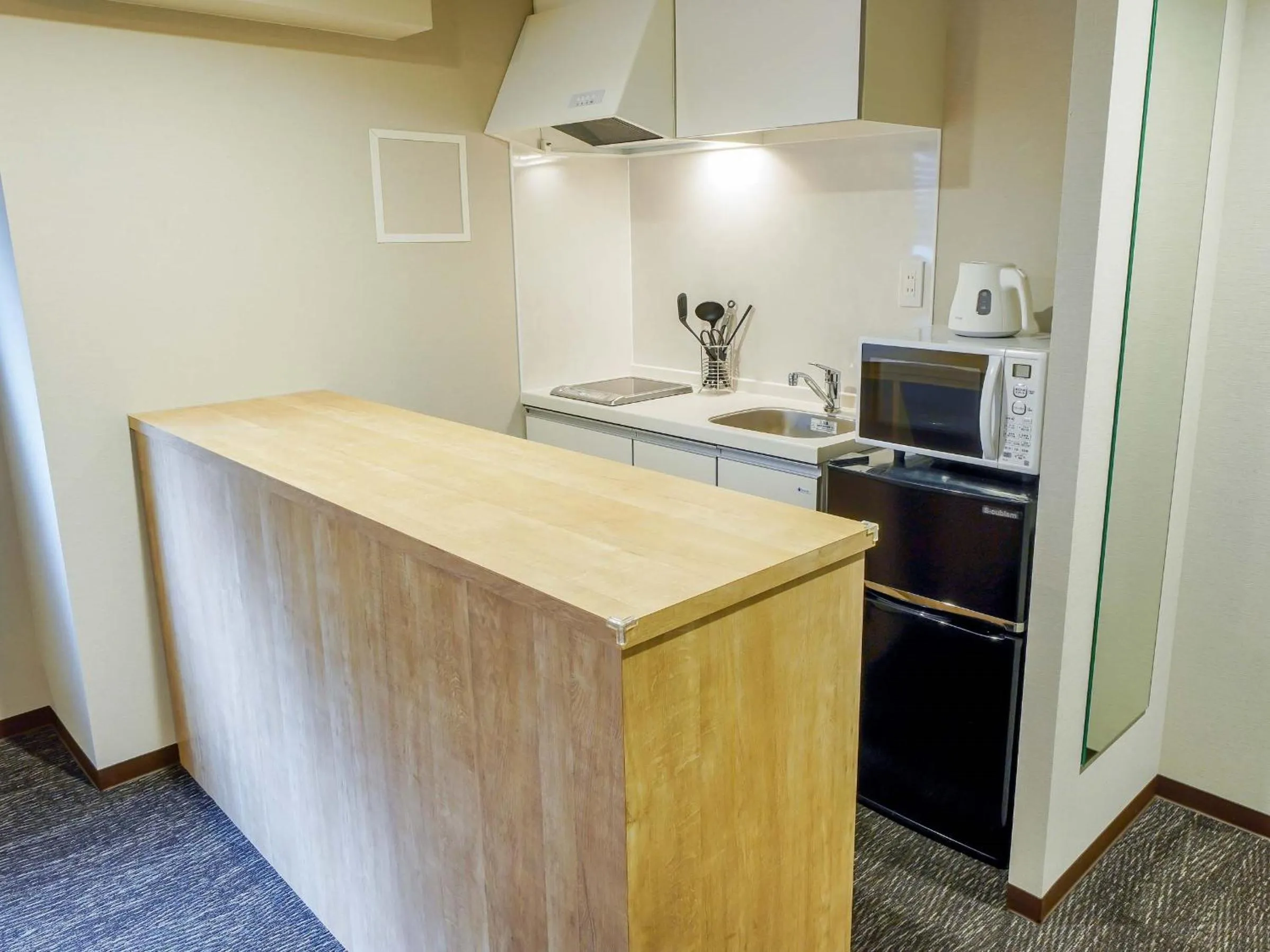 Kitchen or kitchenette in RESI STAY Heart