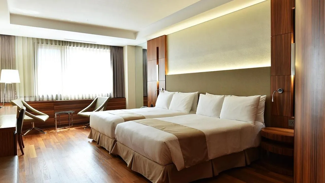 Bed in Pacific Hotel
