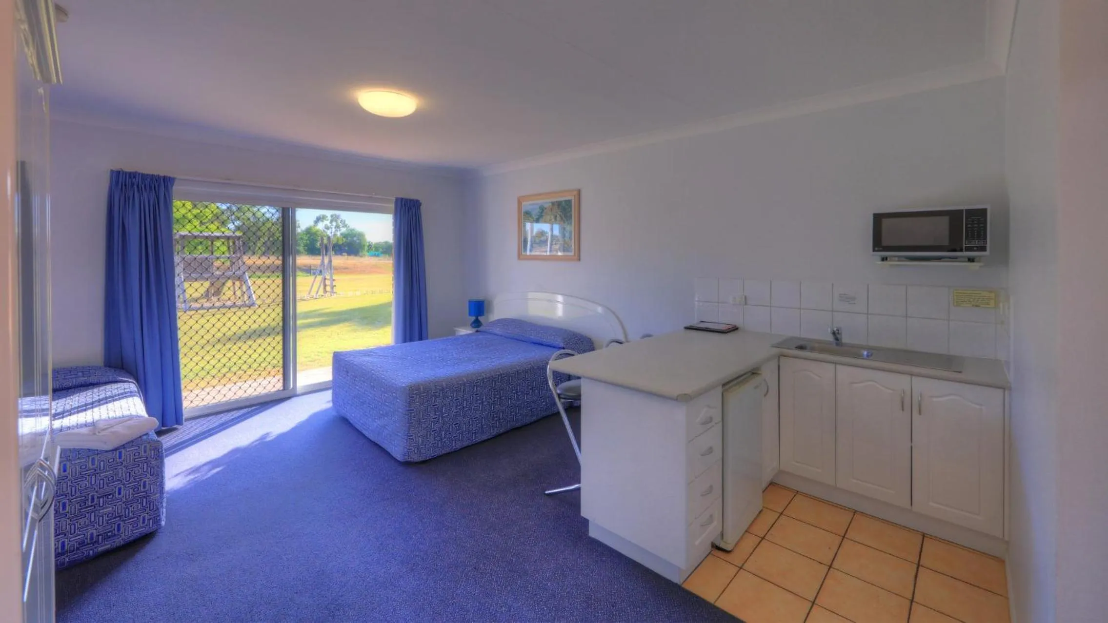 Bedroom in Heritage Lodge Motel