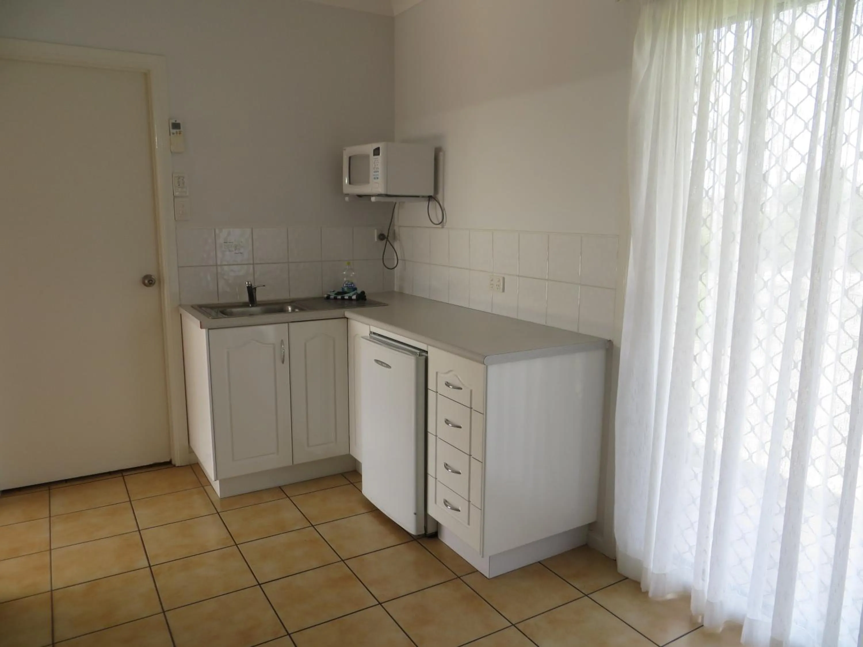 Kitchen or kitchenette in Heritage Lodge Motel