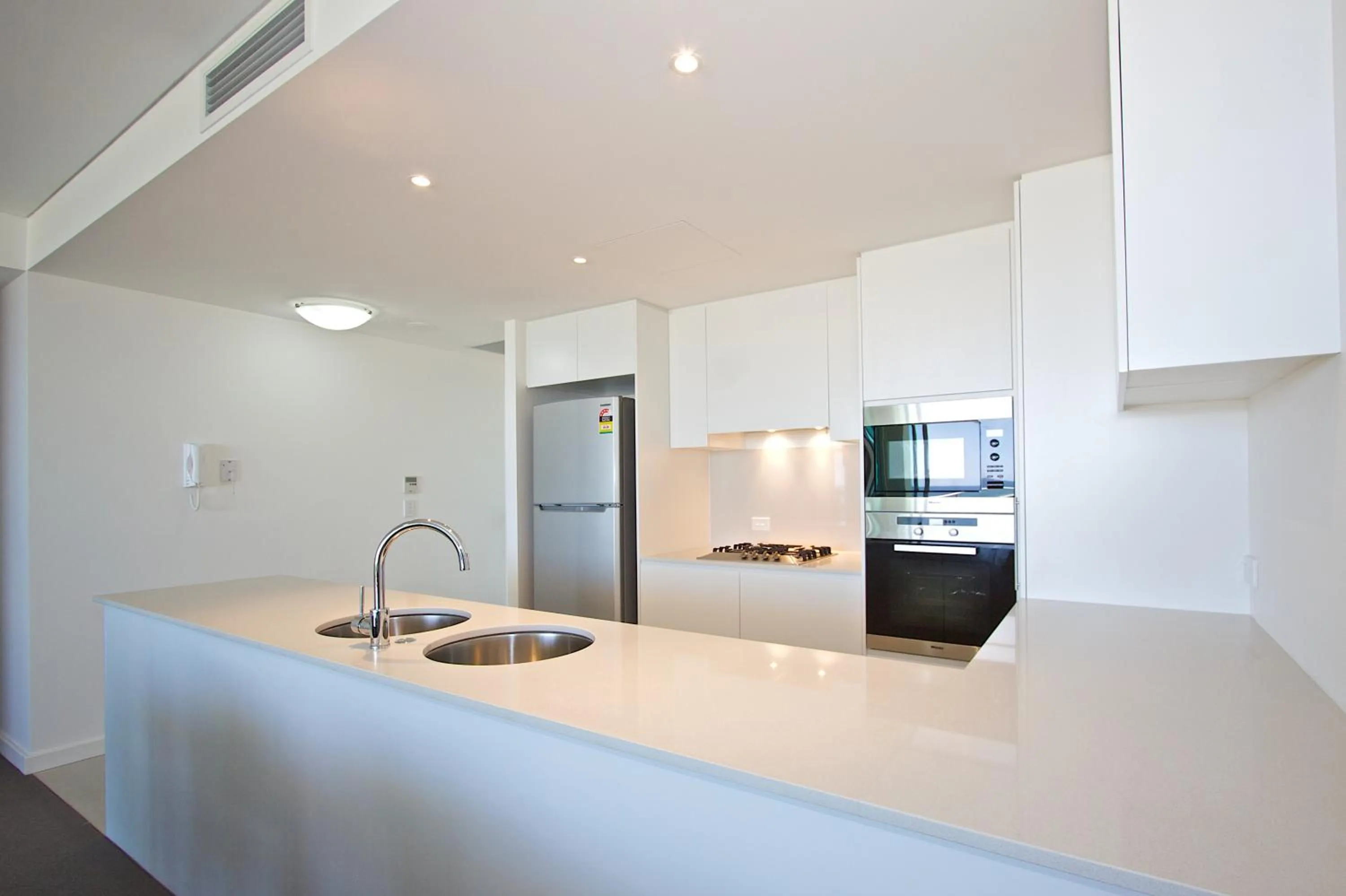 Kitchen or kitchenette in Kirra Surf Apartments