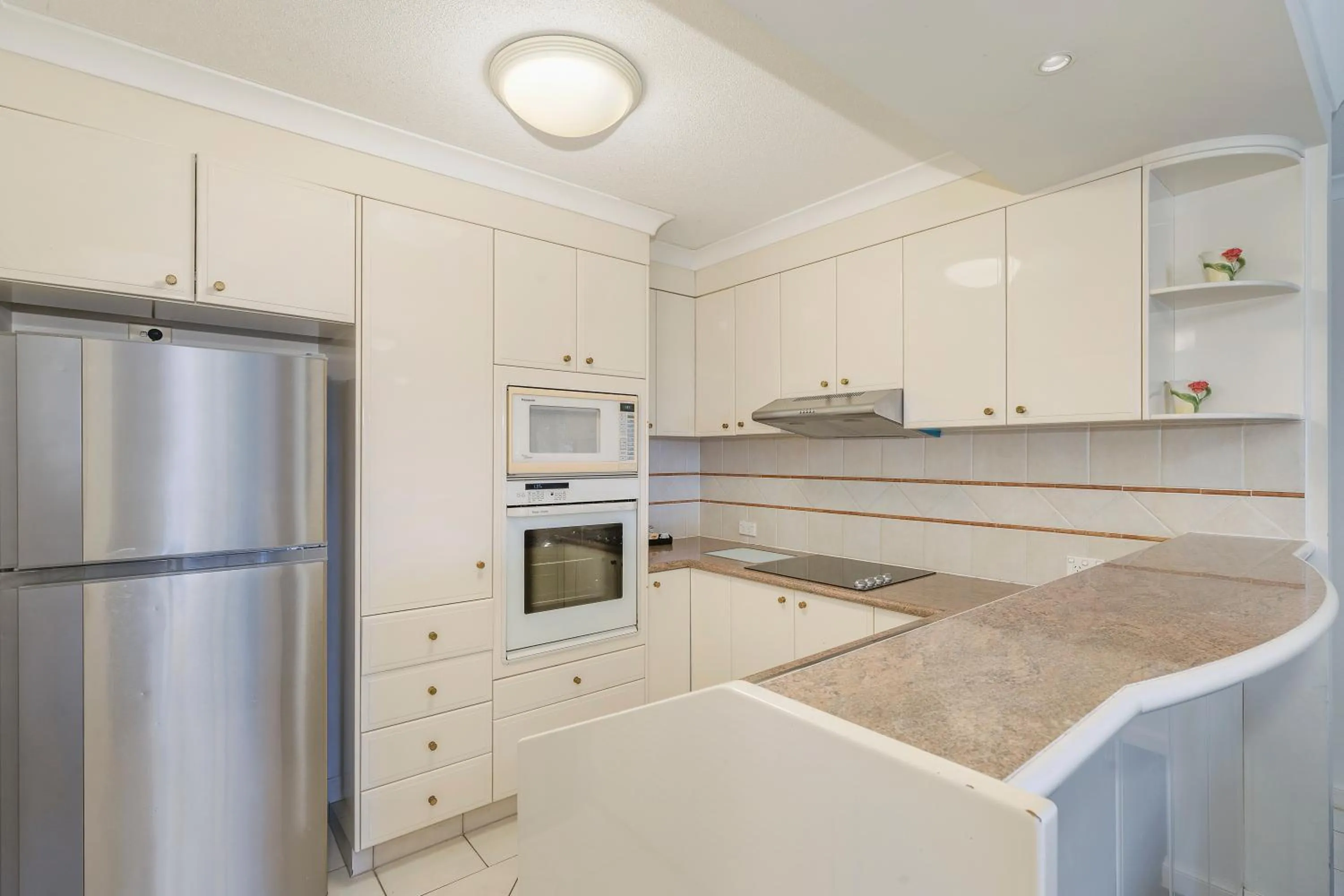 kitchen in ULTIQA Burleigh Mediterranean Resort