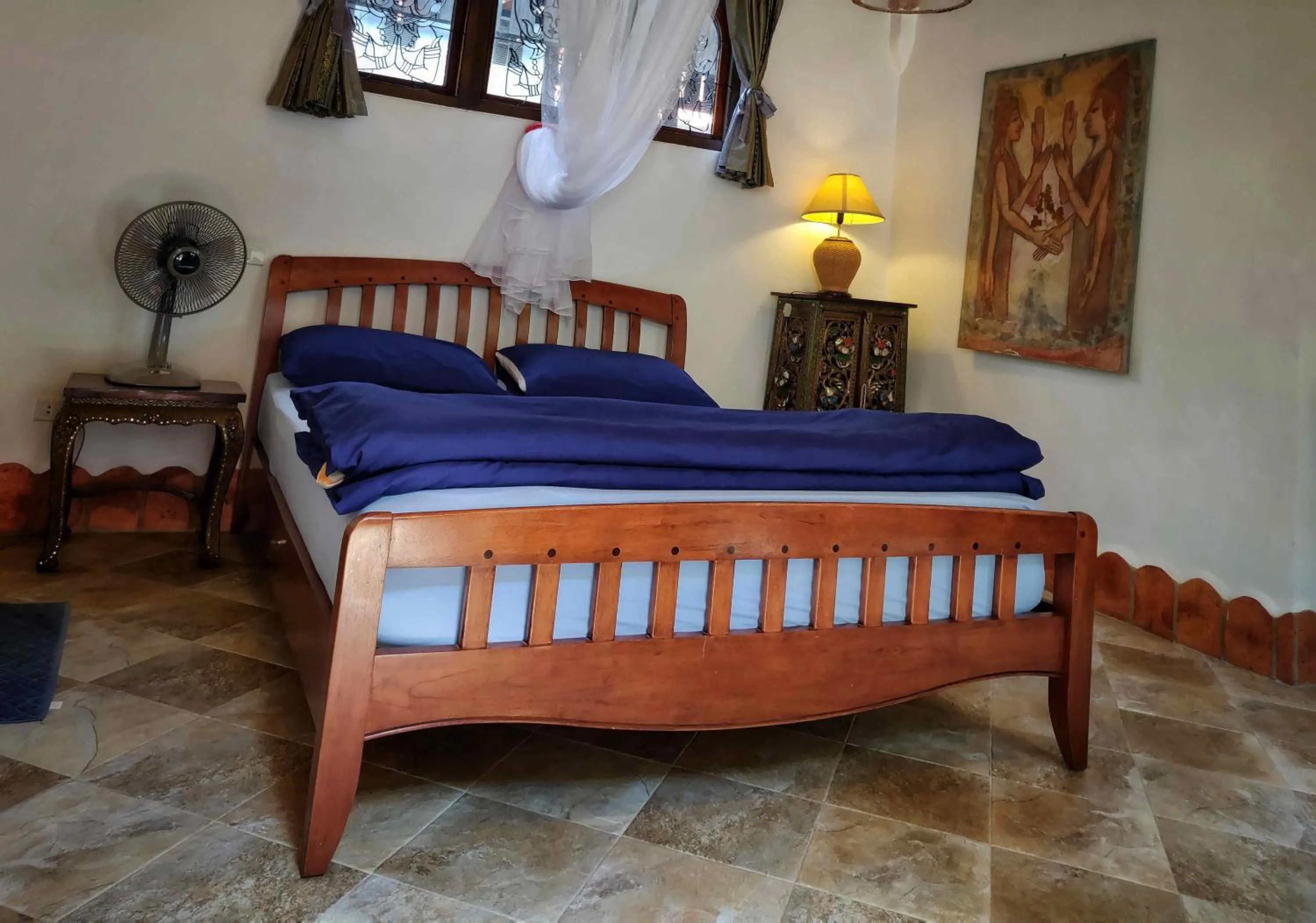 Bed in Mut Mee Garden Guest House