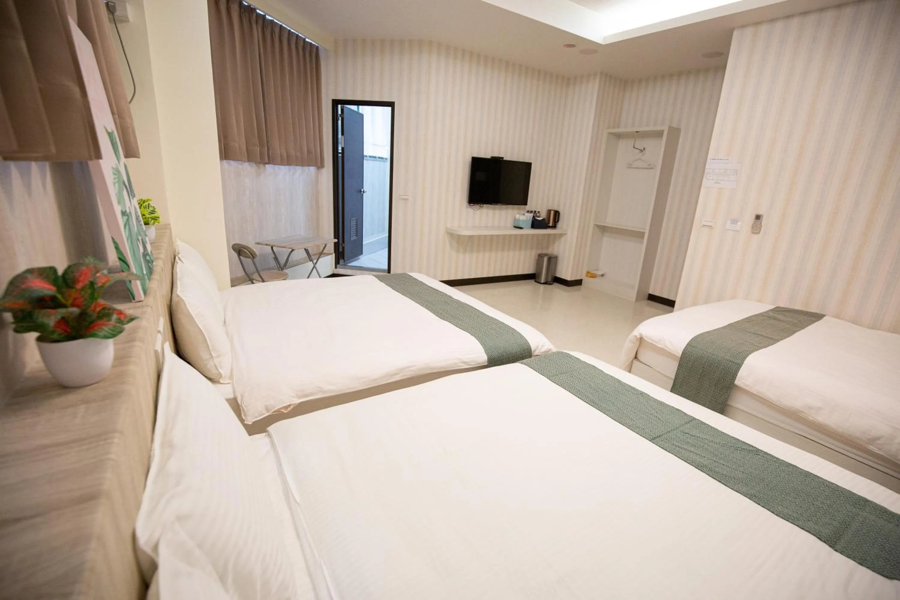 Bed in Jia-Jia Business Hotel