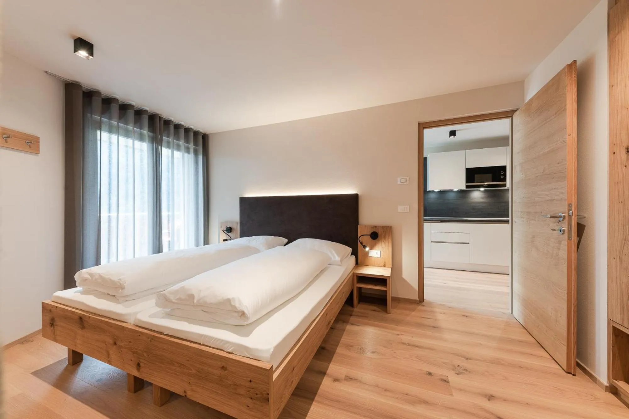 Bed in Aparthotel Abiná Lana Höhe