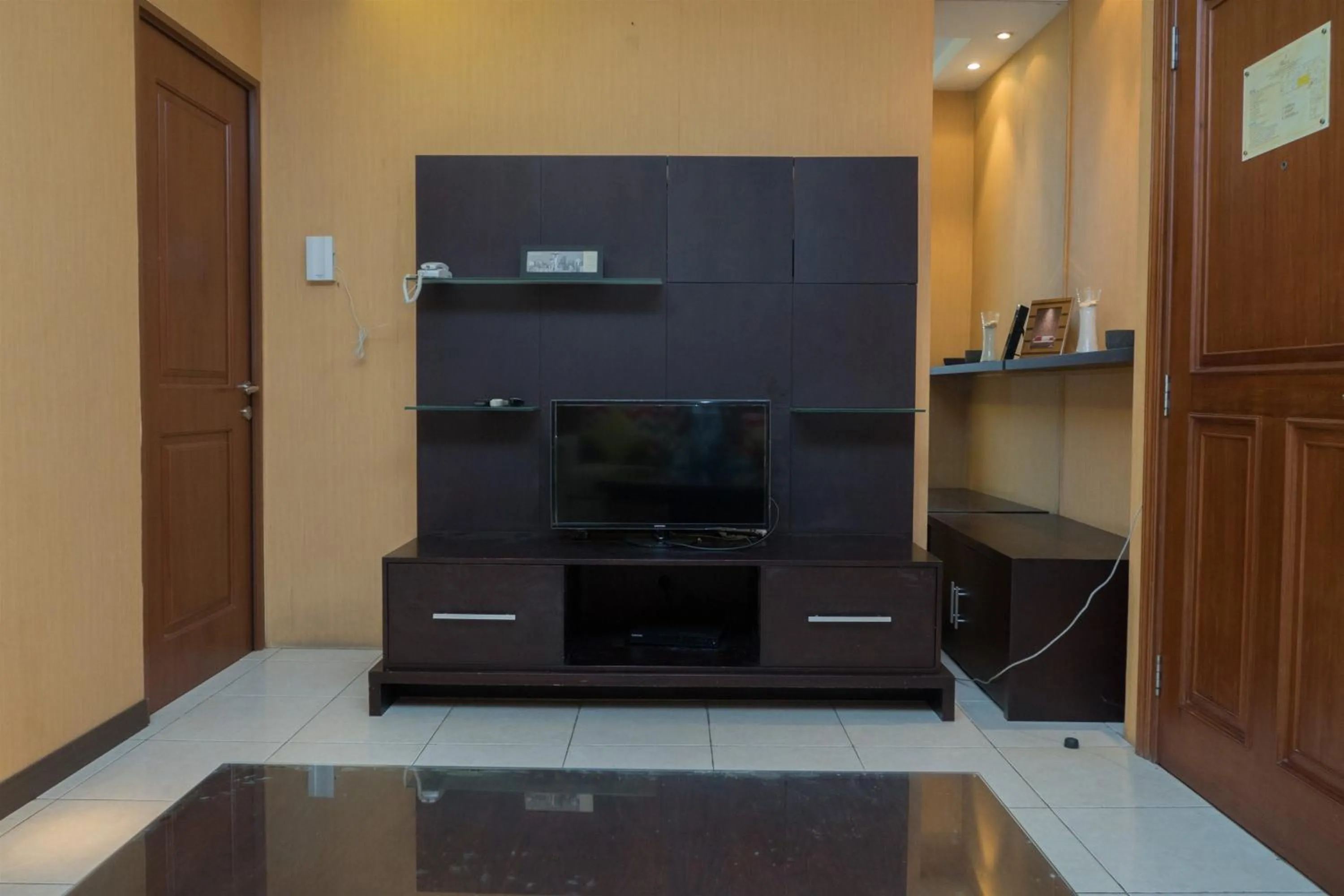 TV and multimedia in Antique 3BR at Grand Setiabudi Apartment By Travelio