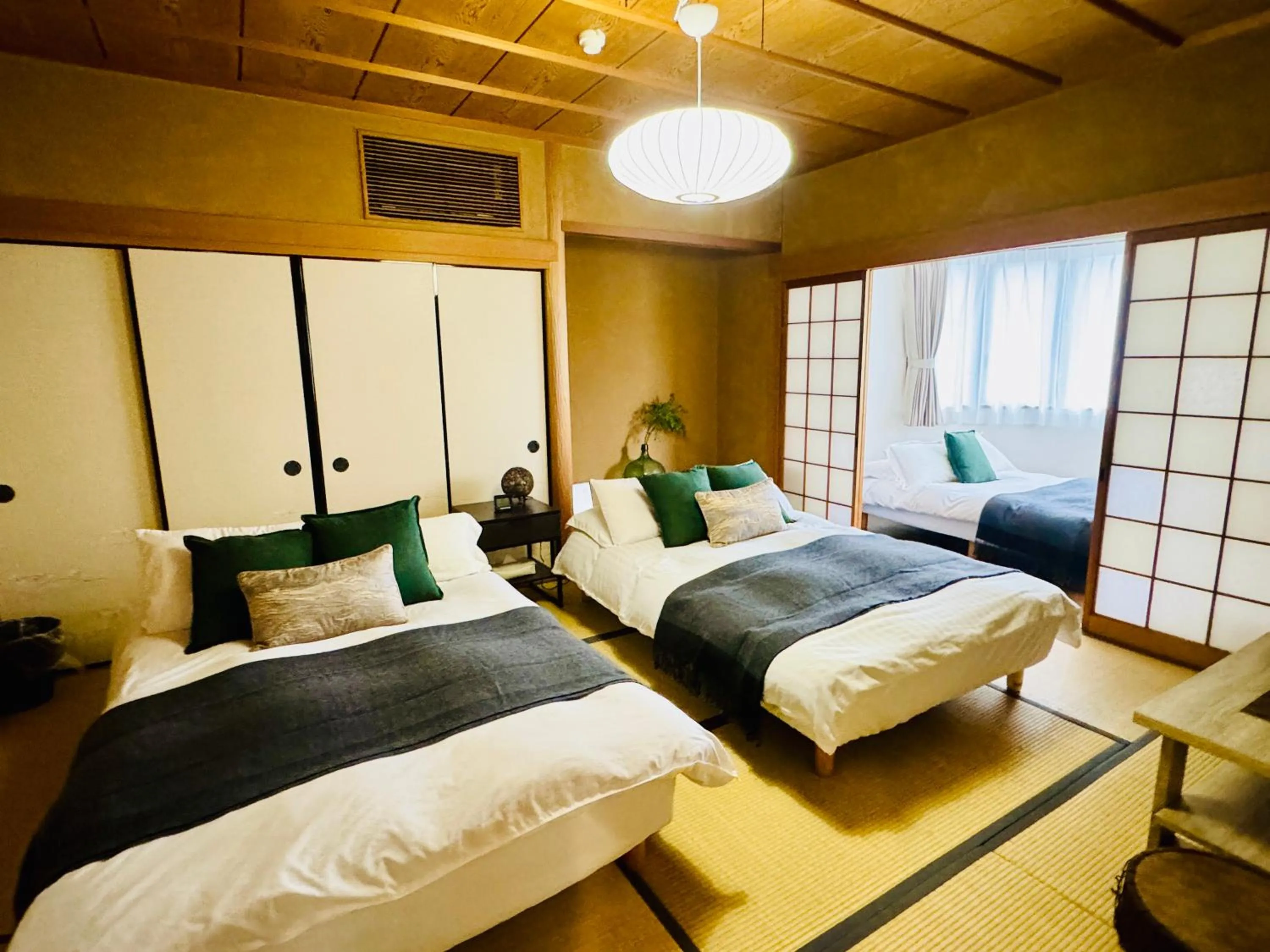 Bed in Crest Daikoku Owner's room -vacation rental-
