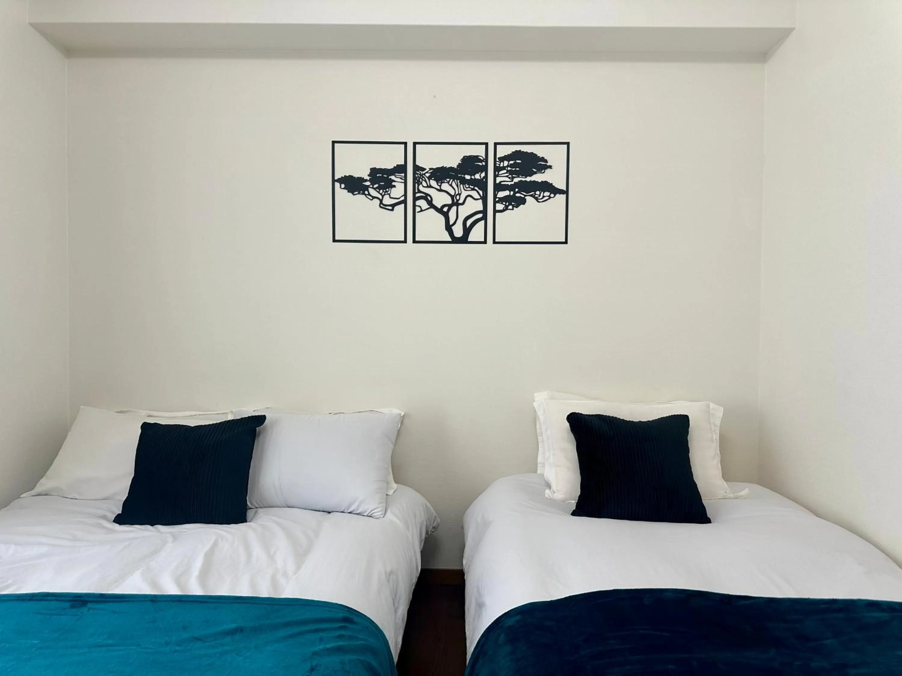 Bed in Crest Daikoku Owner's room -vacation rental-