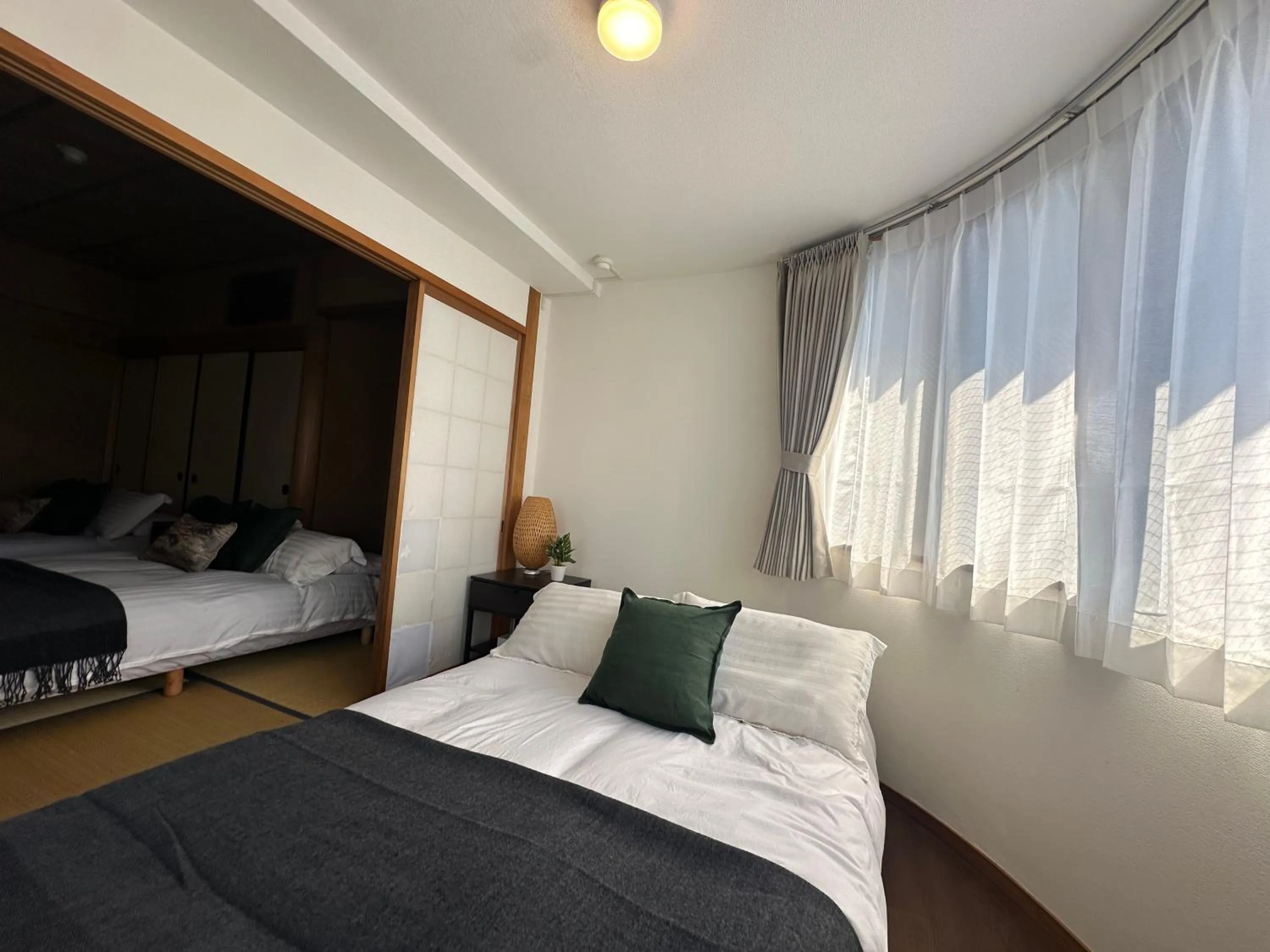 Bed in Crest Daikoku Owner's room -vacation rental-