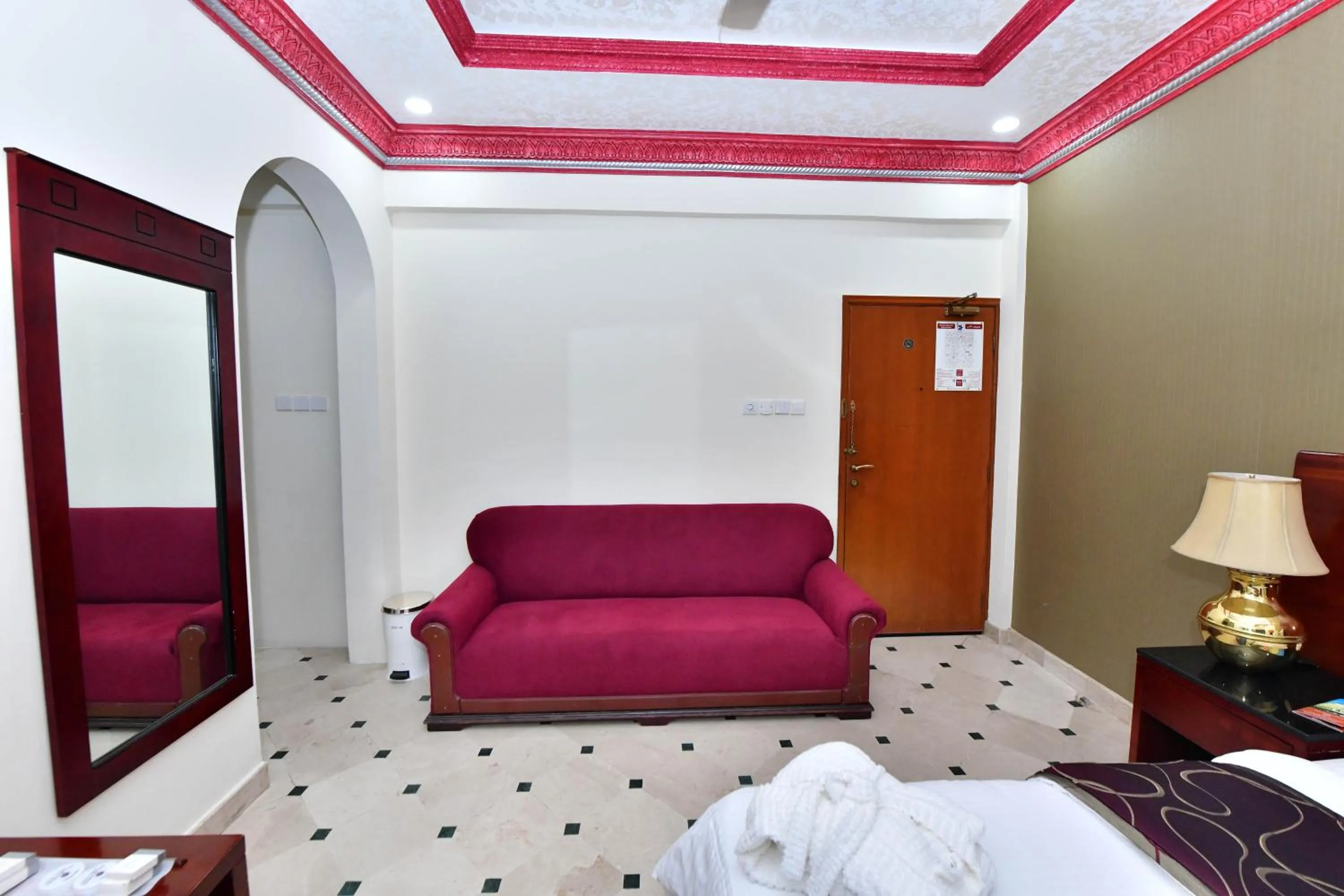 Seating area, Bed in Al Bahjah Hotel