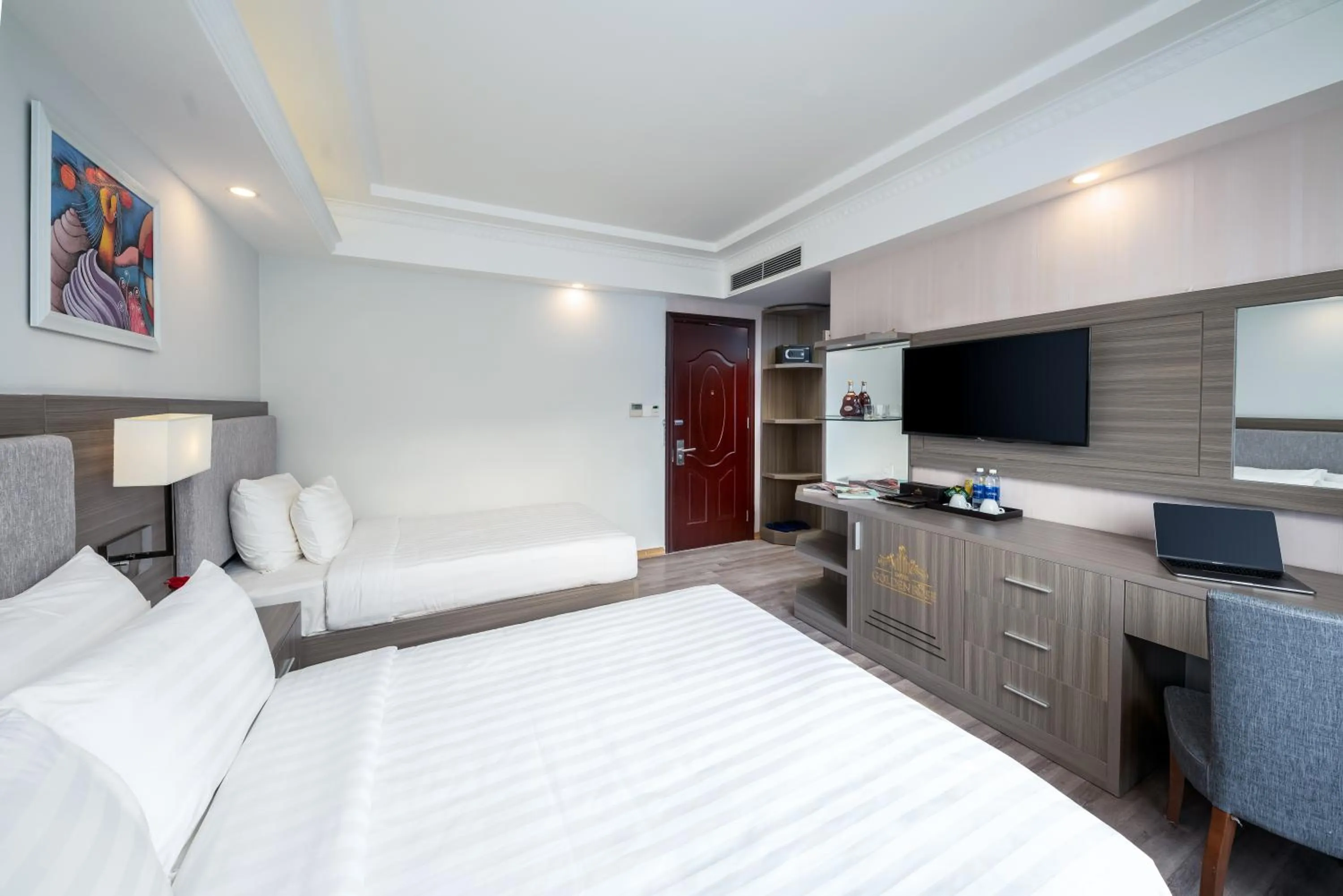 Communal lounge/ TV room, Bed in Golden Rose Hotel