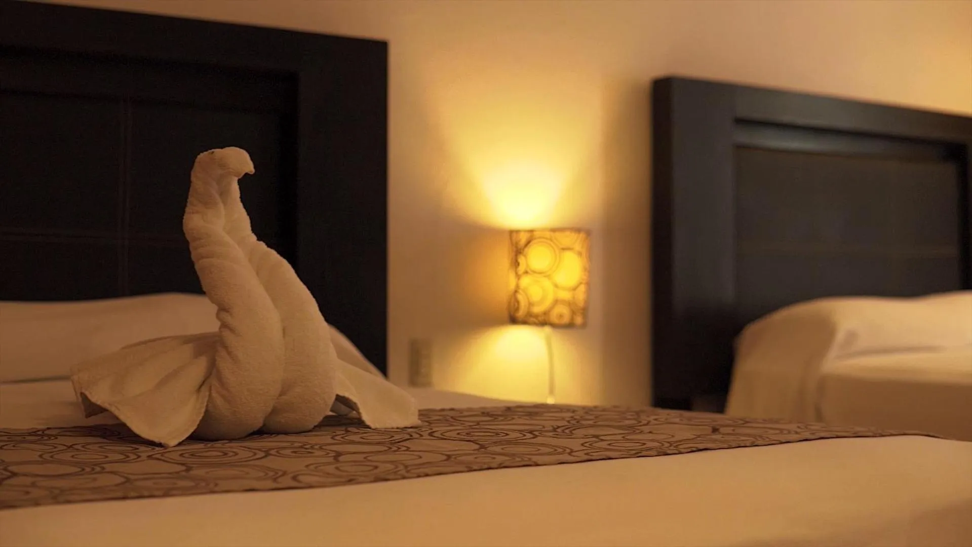 Bed in Hotel Santa Cruz Huatulco