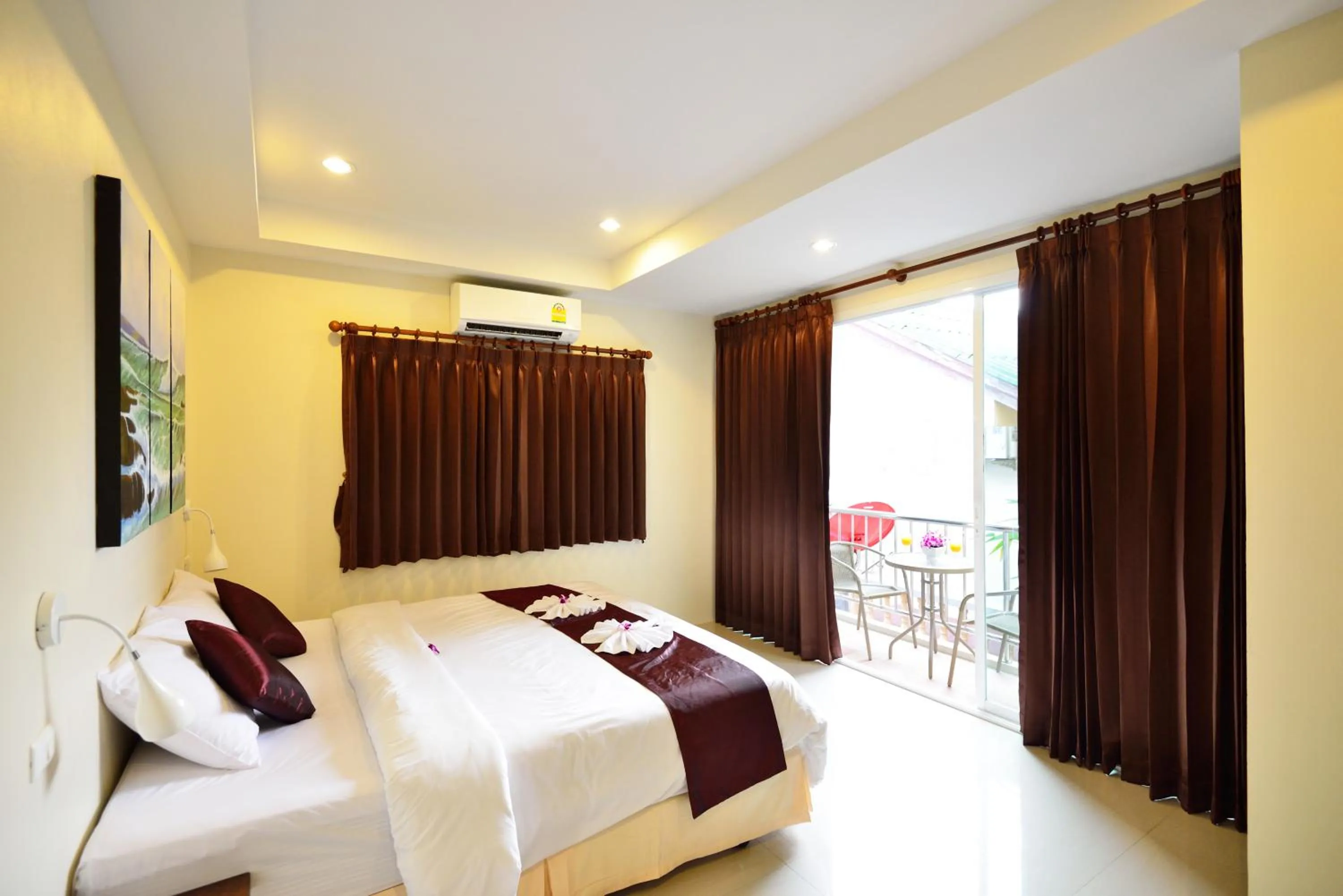 Bed in At Kamala Hotel