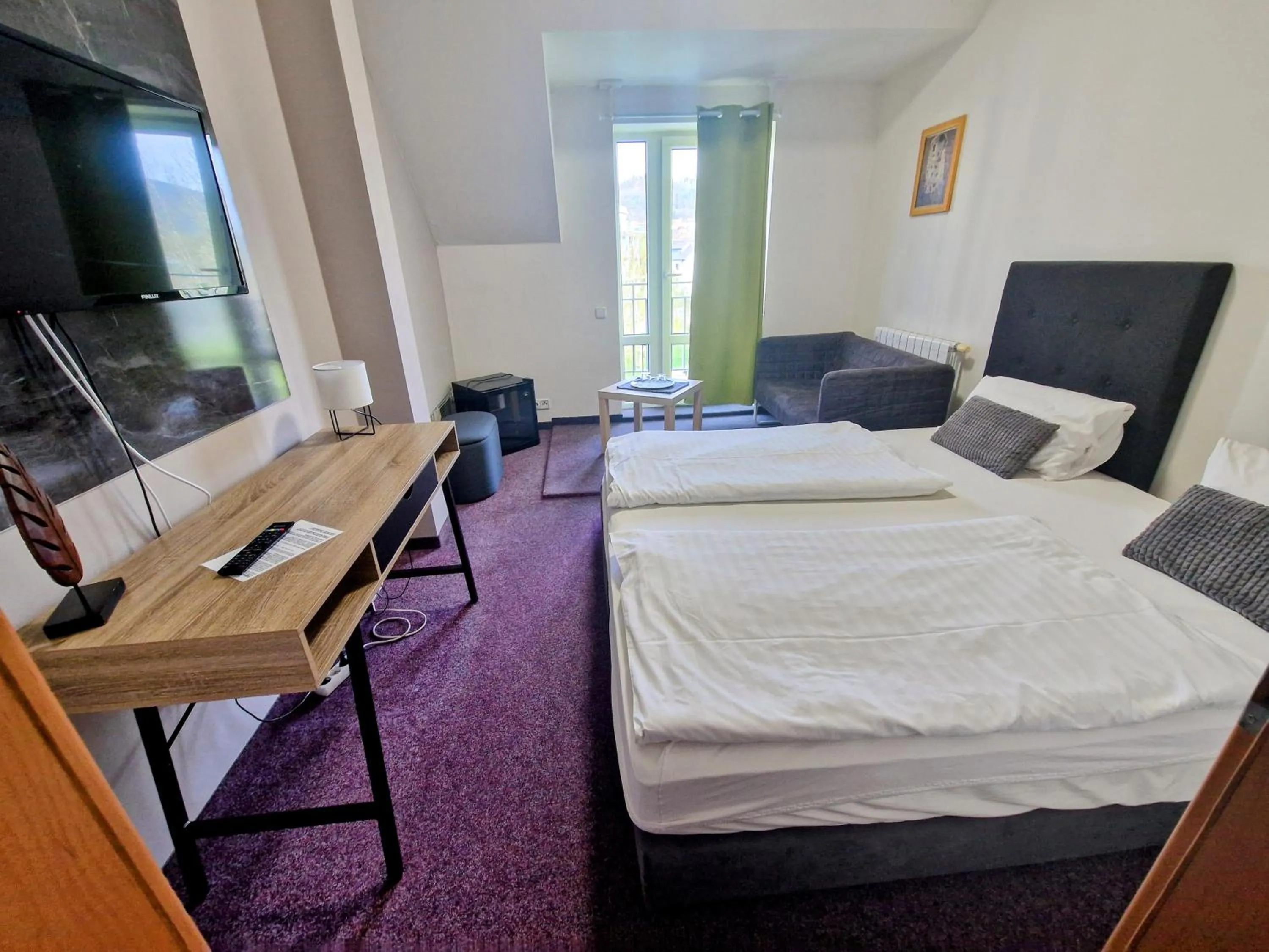 Bed in Family hotel Maxim