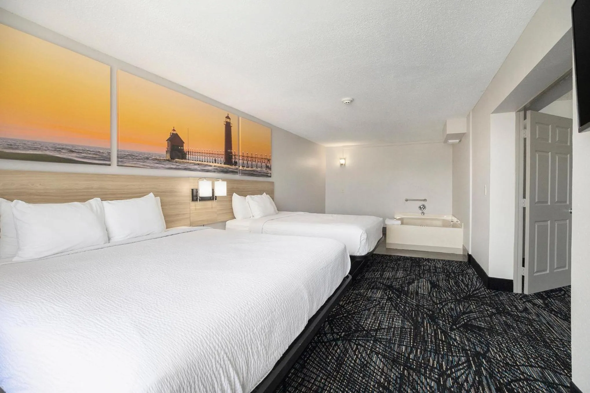 Bed in Days Inn & Suites by Wyndham Norton Shores Muskegon