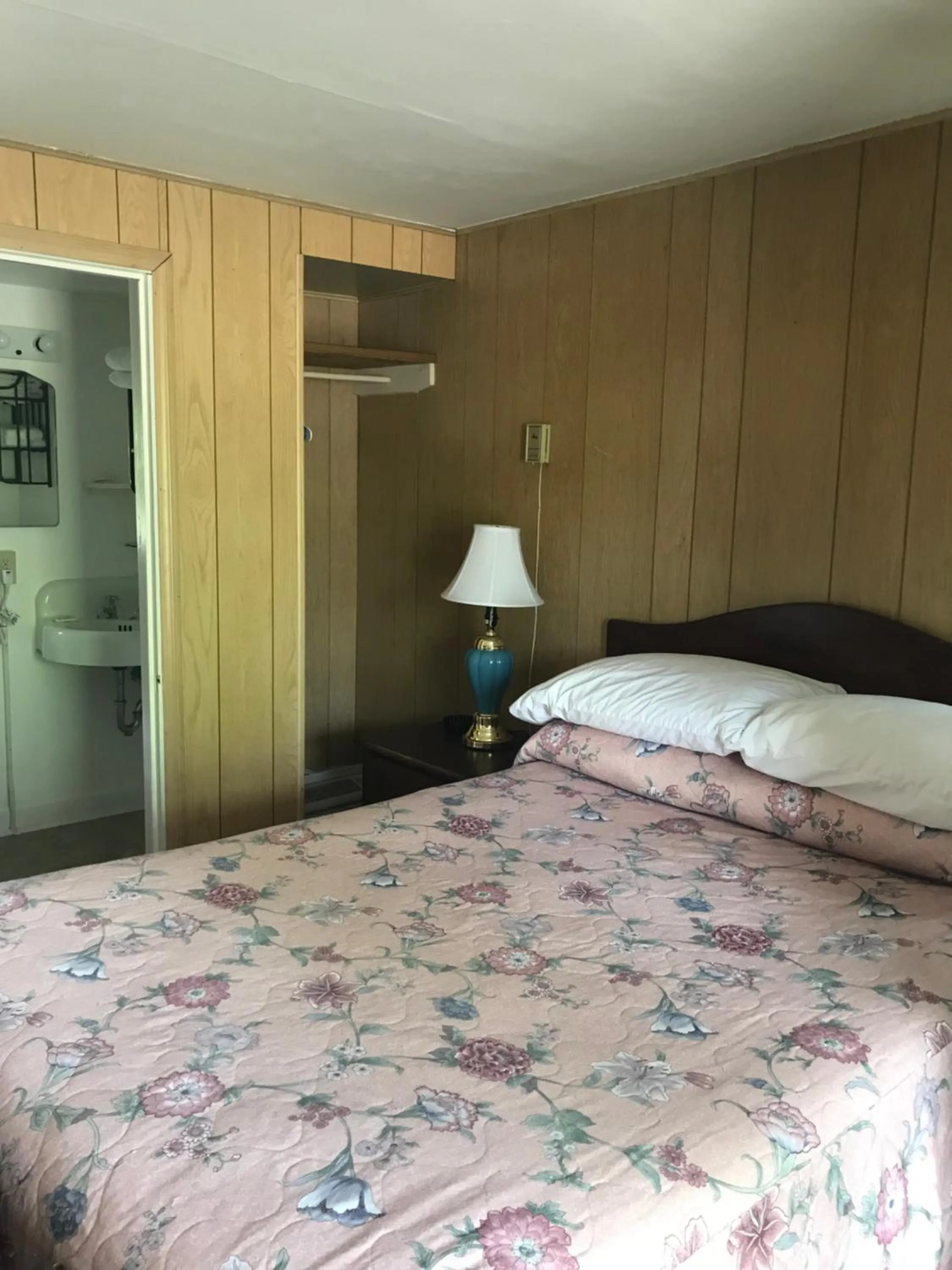 Bed in Evergreen Motel