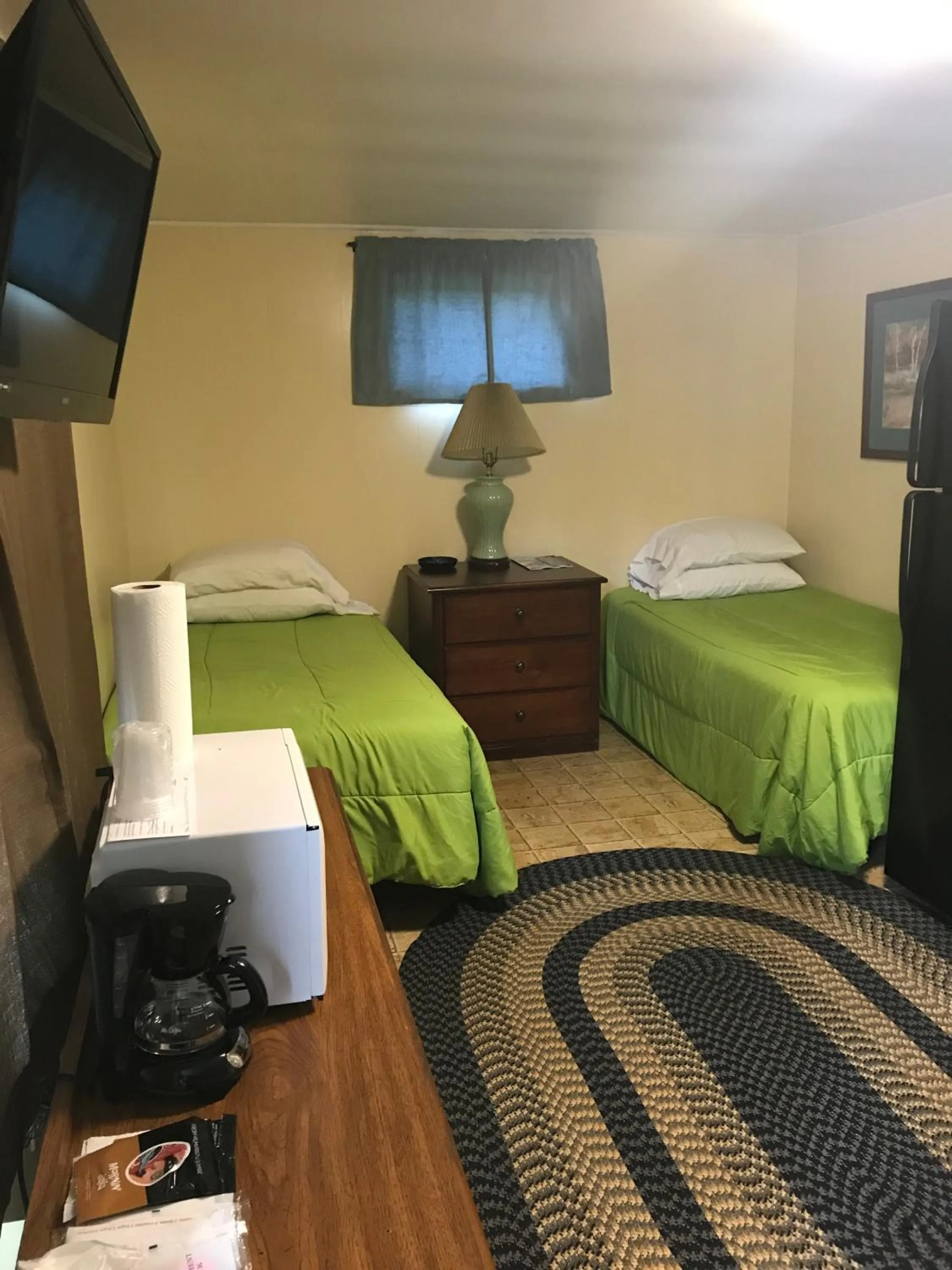 Bed in Evergreen Motel