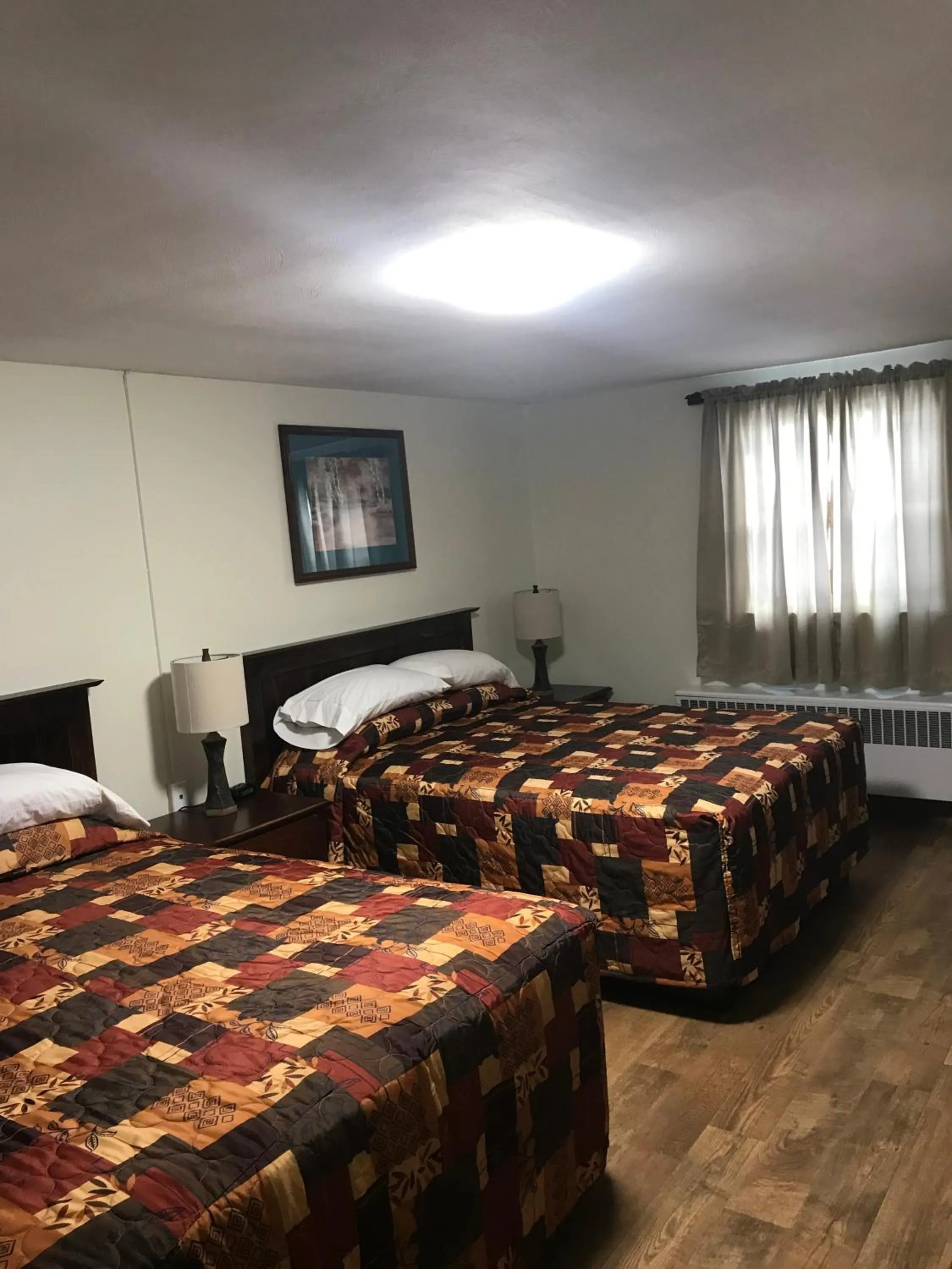 Bed in Evergreen Motel