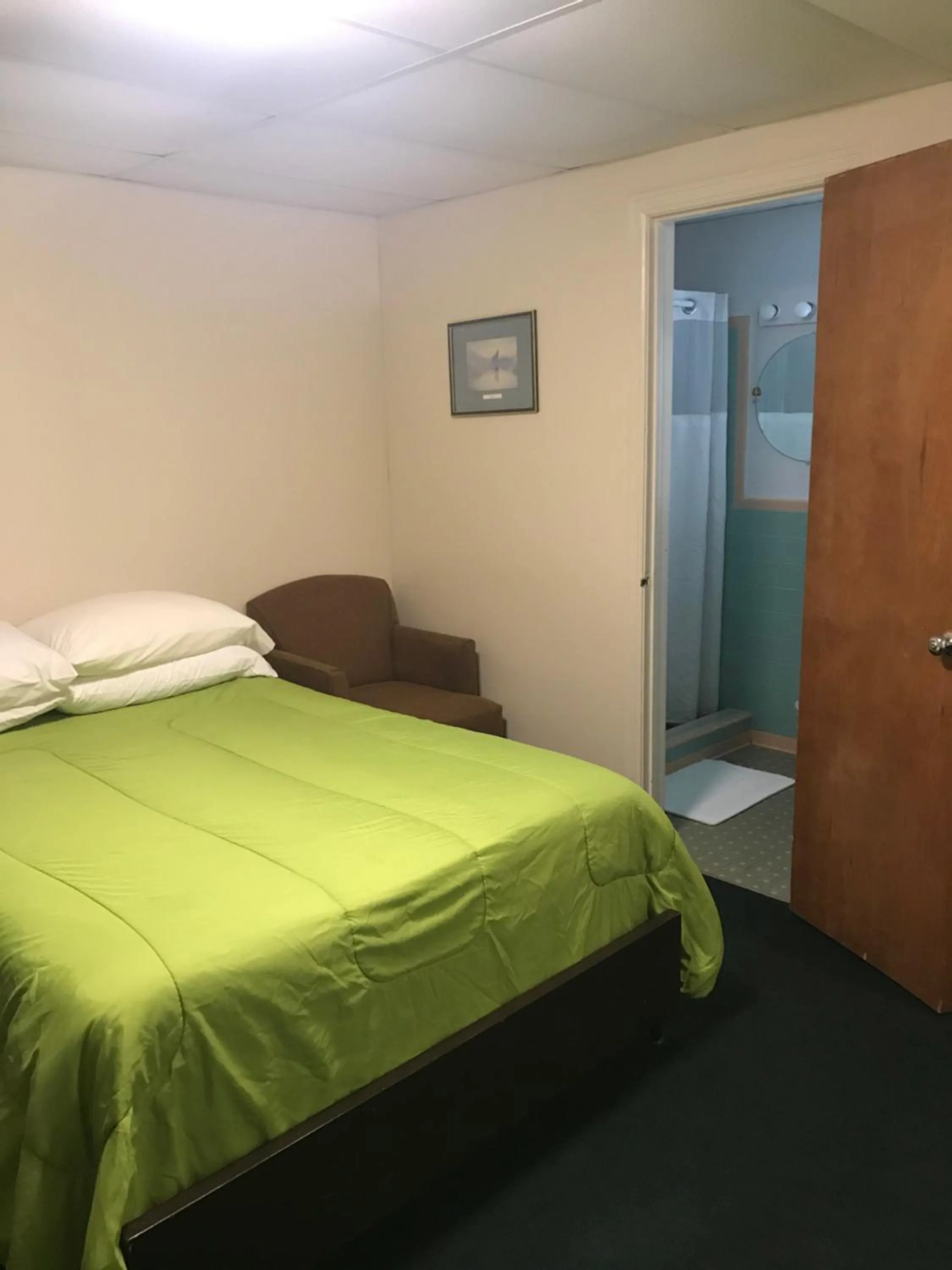 Bed in Evergreen Motel