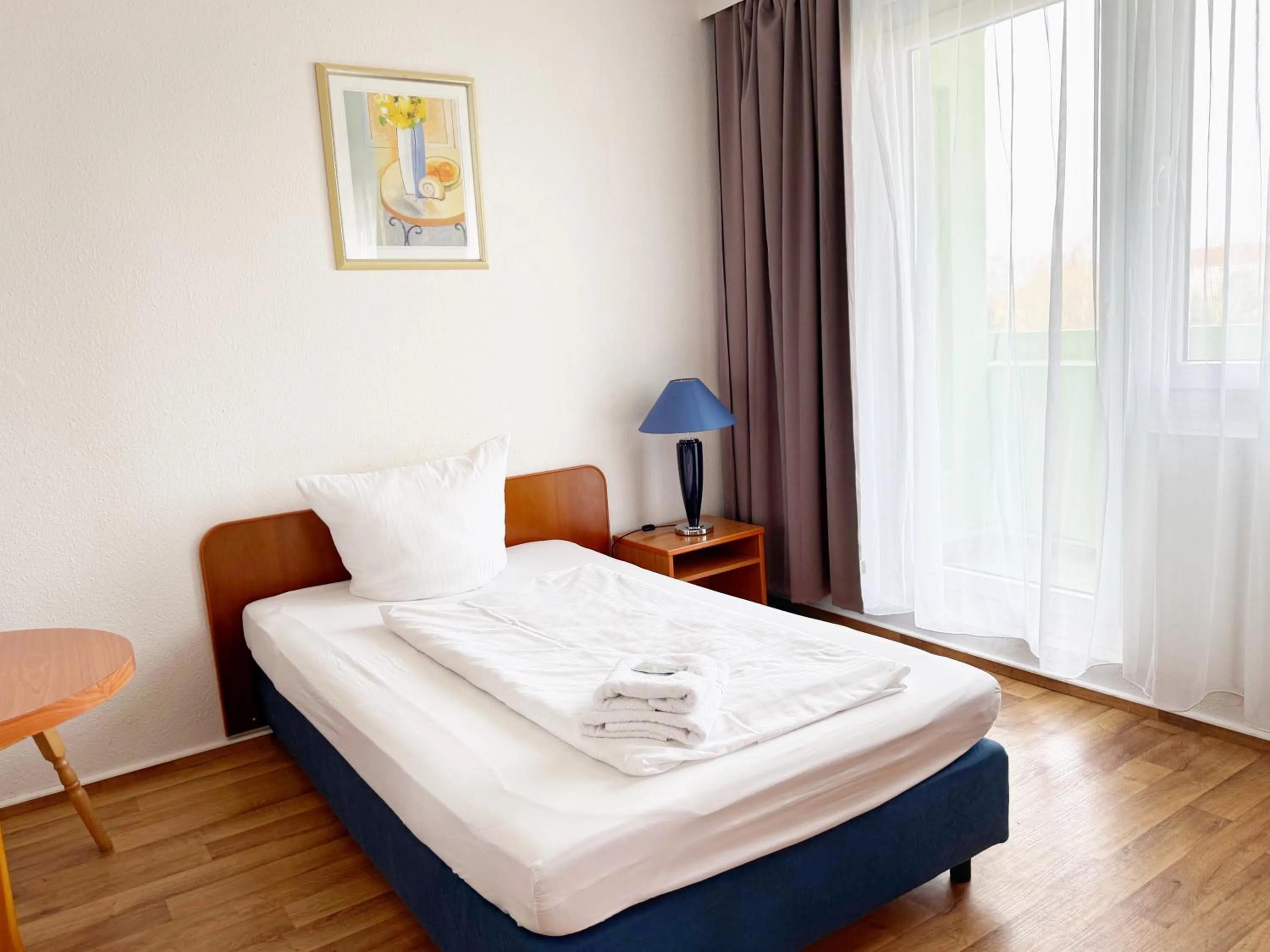 Bed in Alpha Apparthotel leipzig-Rötha