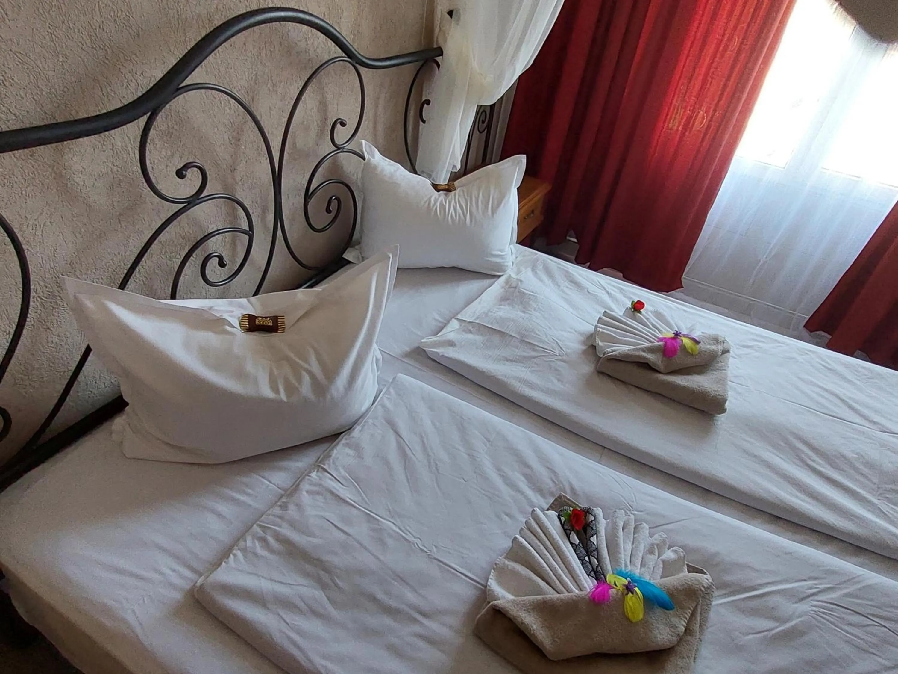 Bed in Paralax Hotel