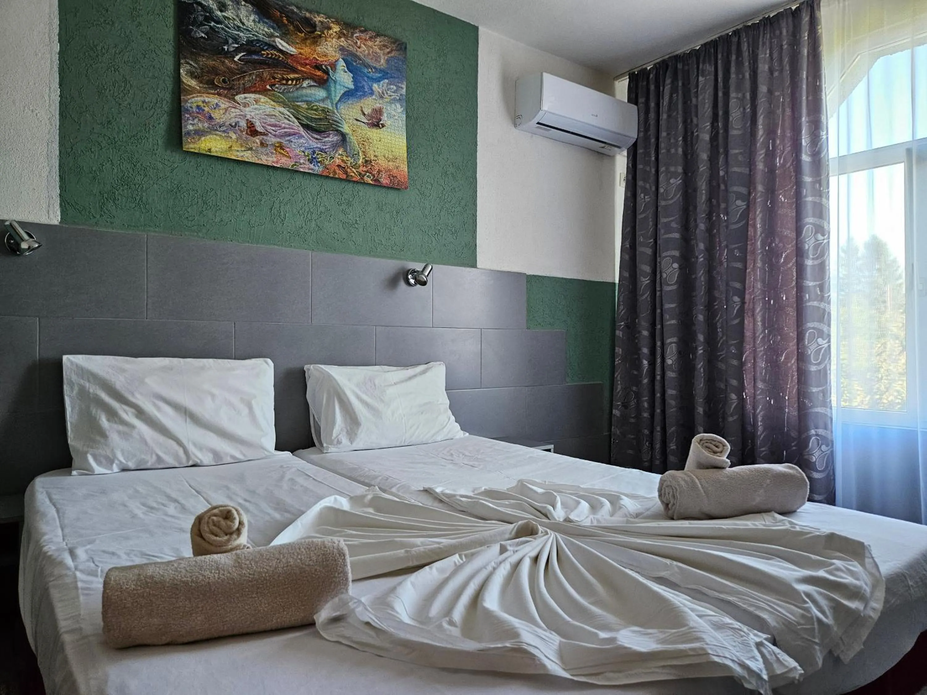 Bed in Paralax Hotel