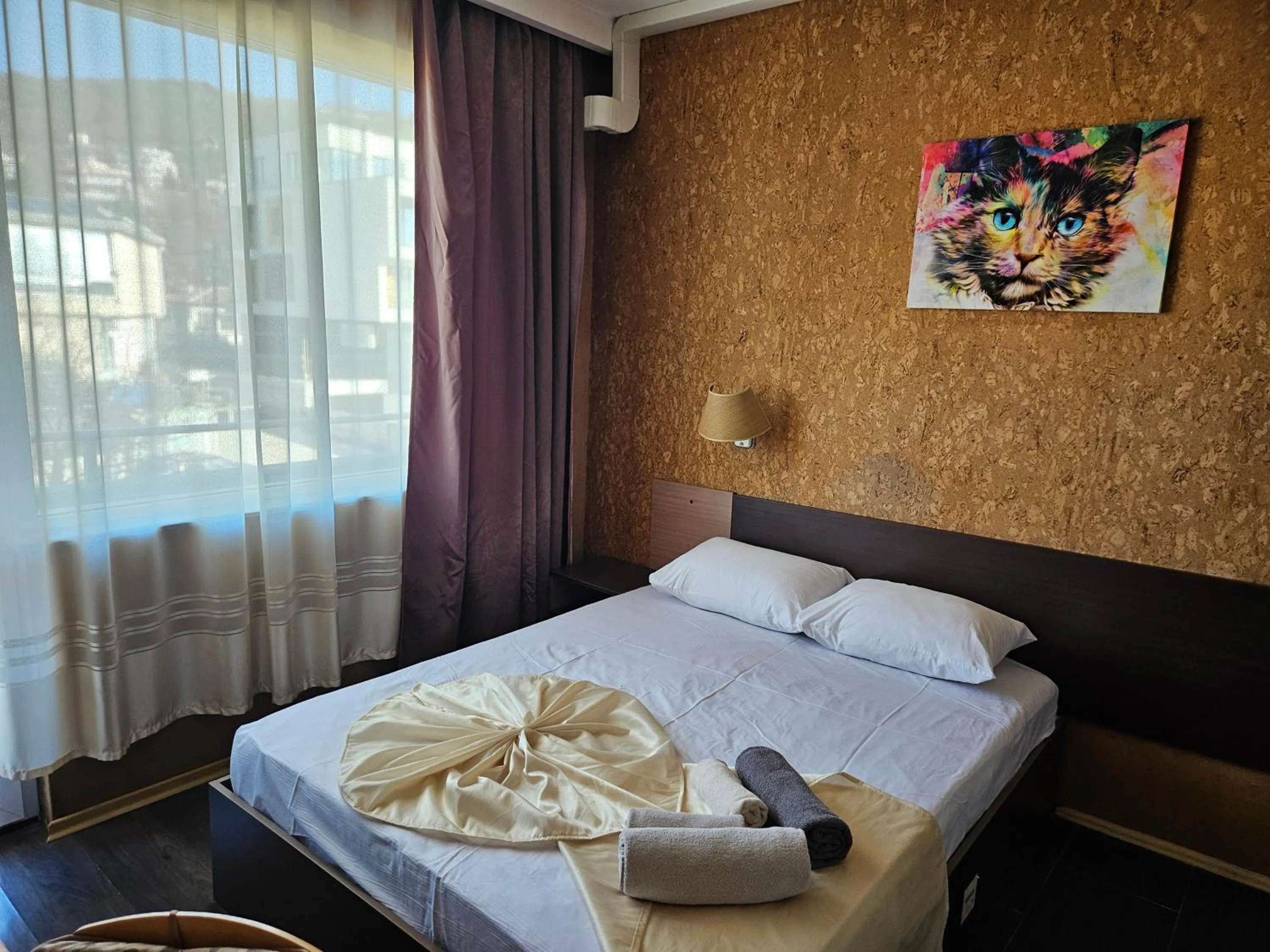 Bed in Paralax Hotel