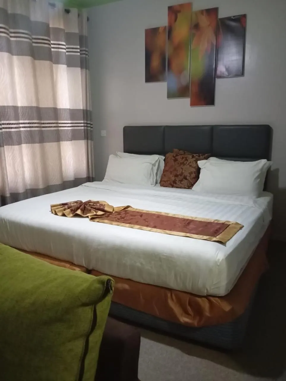 Bed in Maple Inn Hotel