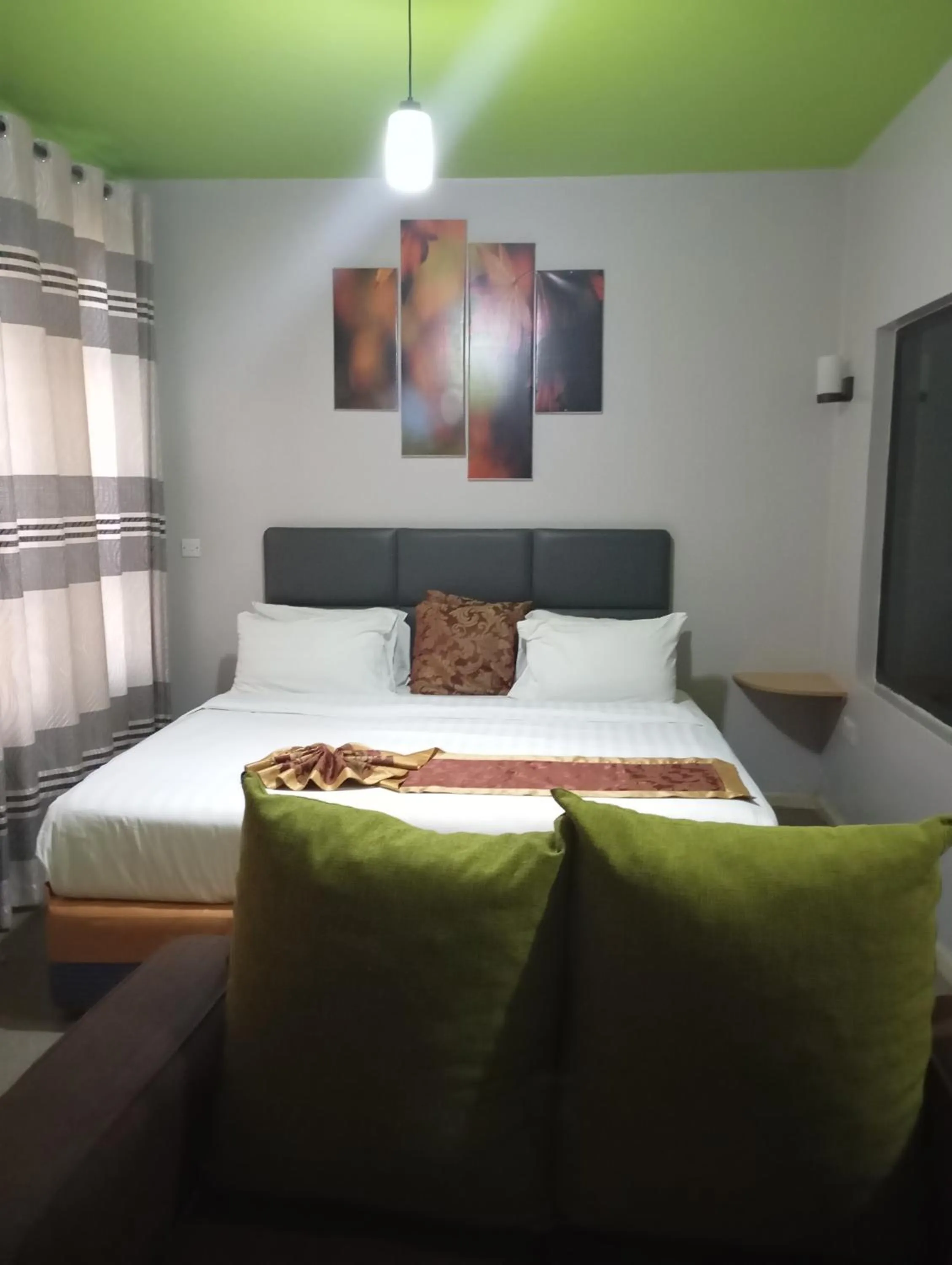 Bed in Maple Inn Hotel