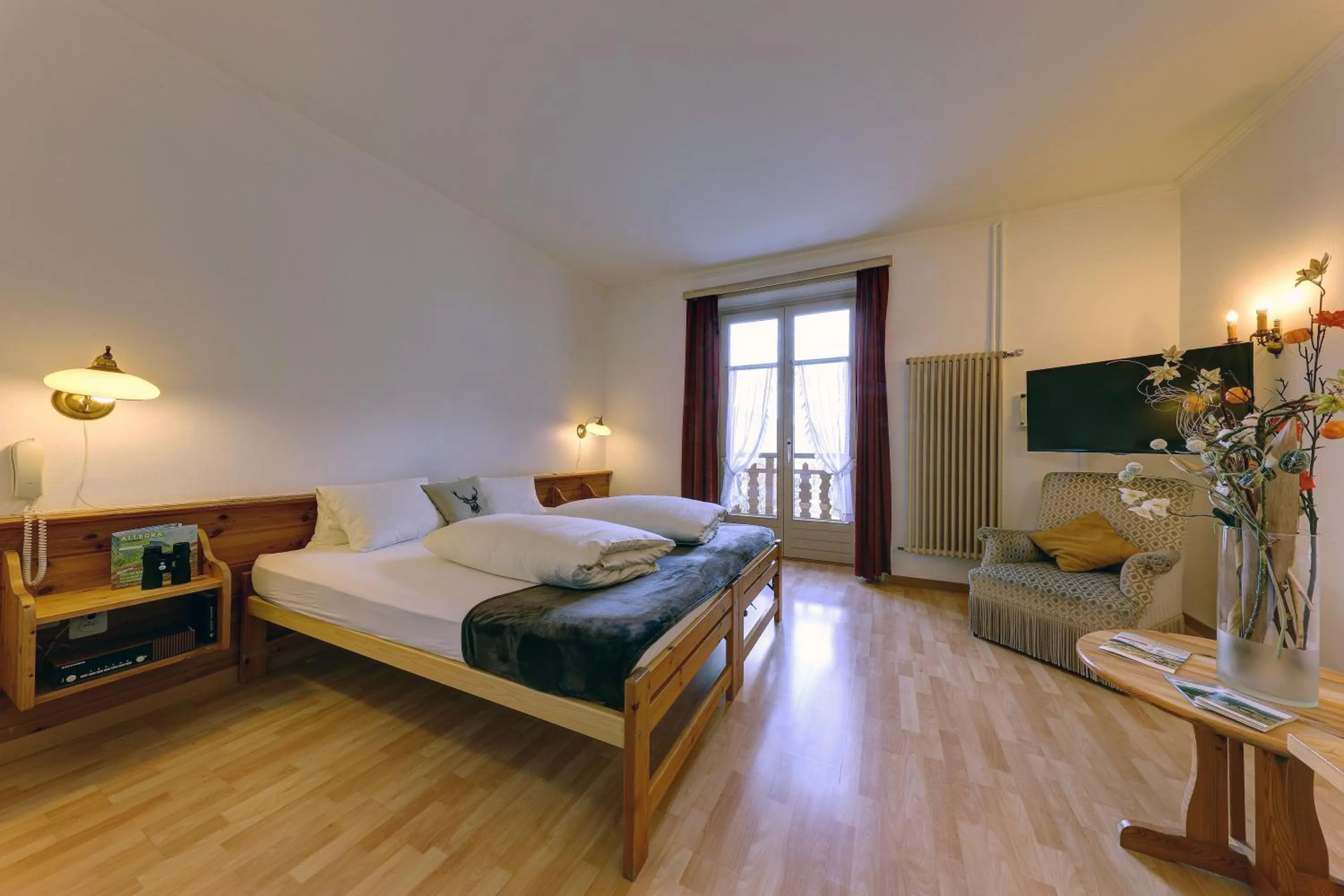 Photo of the whole room, Bed in Hotel Schweizerhof Sta Maria