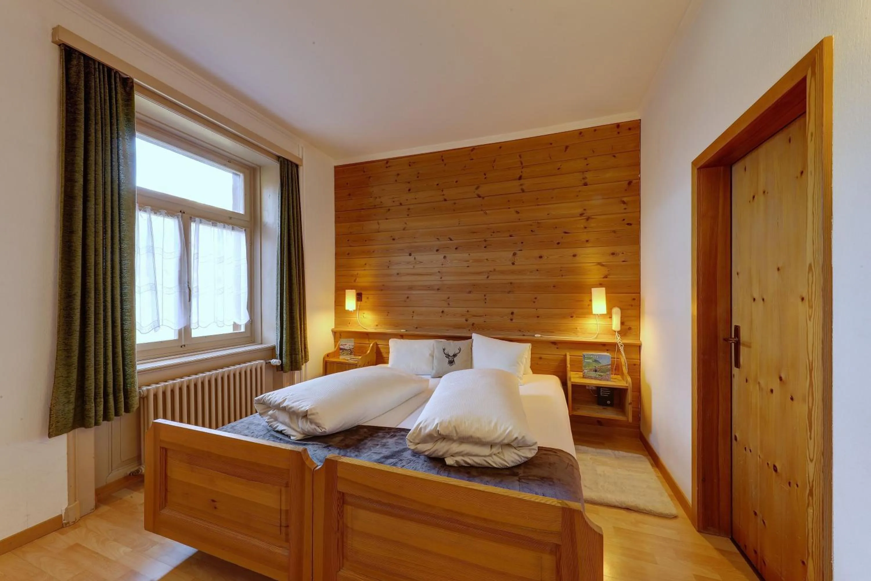 Photo of the whole room, Bed in Hotel Schweizerhof Sta Maria