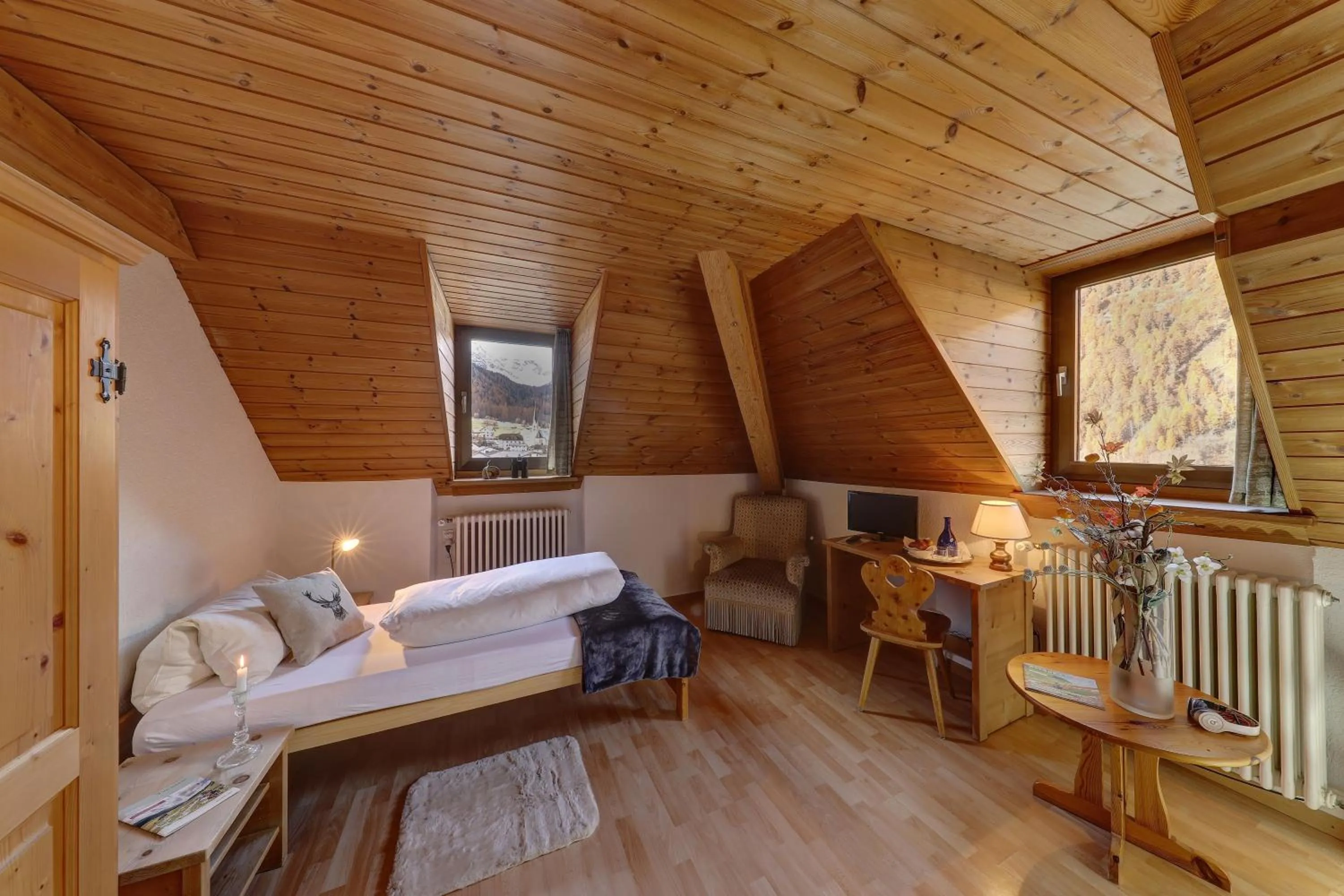 Photo of the whole room, Bed in Hotel Schweizerhof Sta Maria