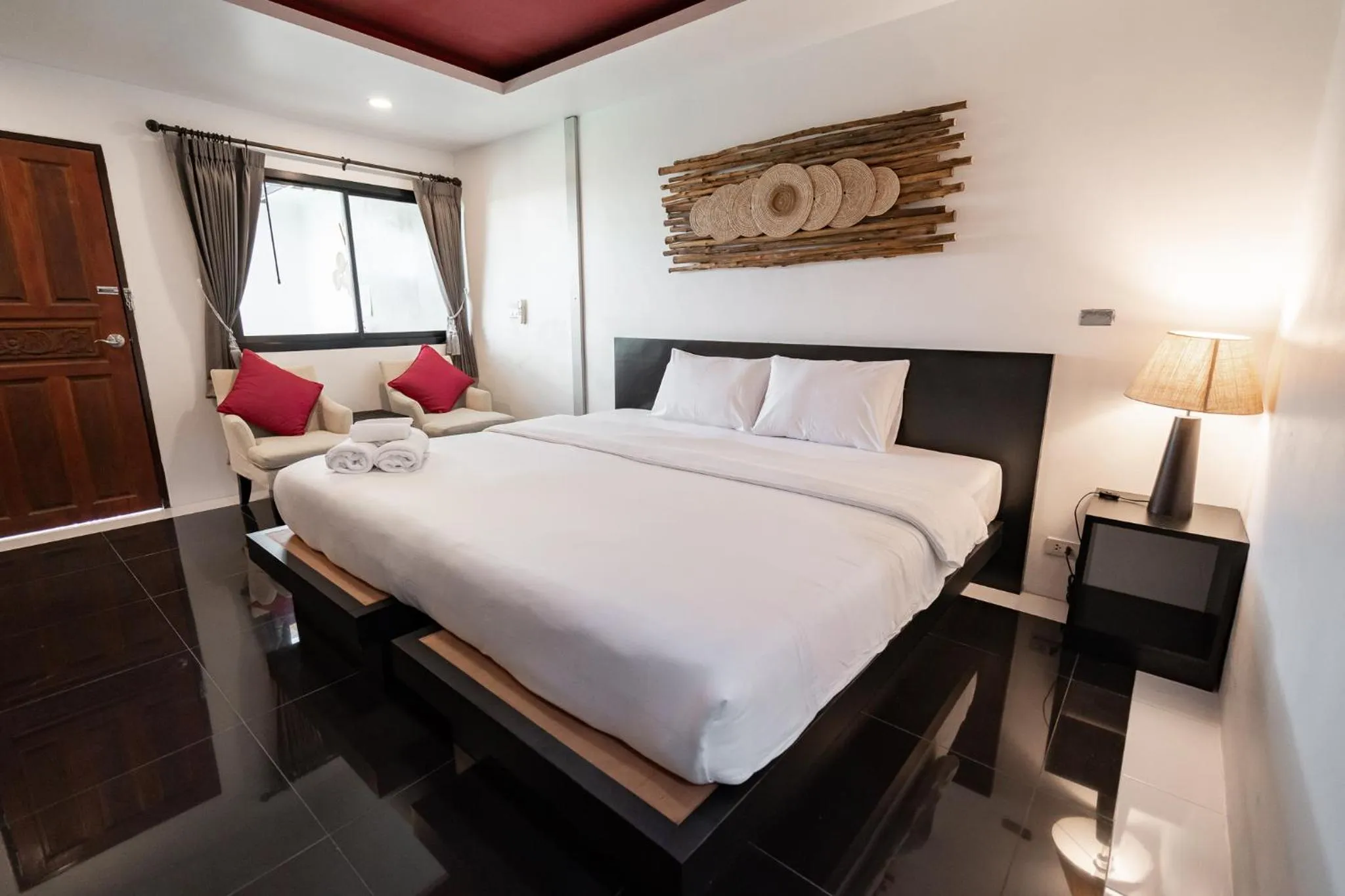 Bed in The Loft Panwa Resort