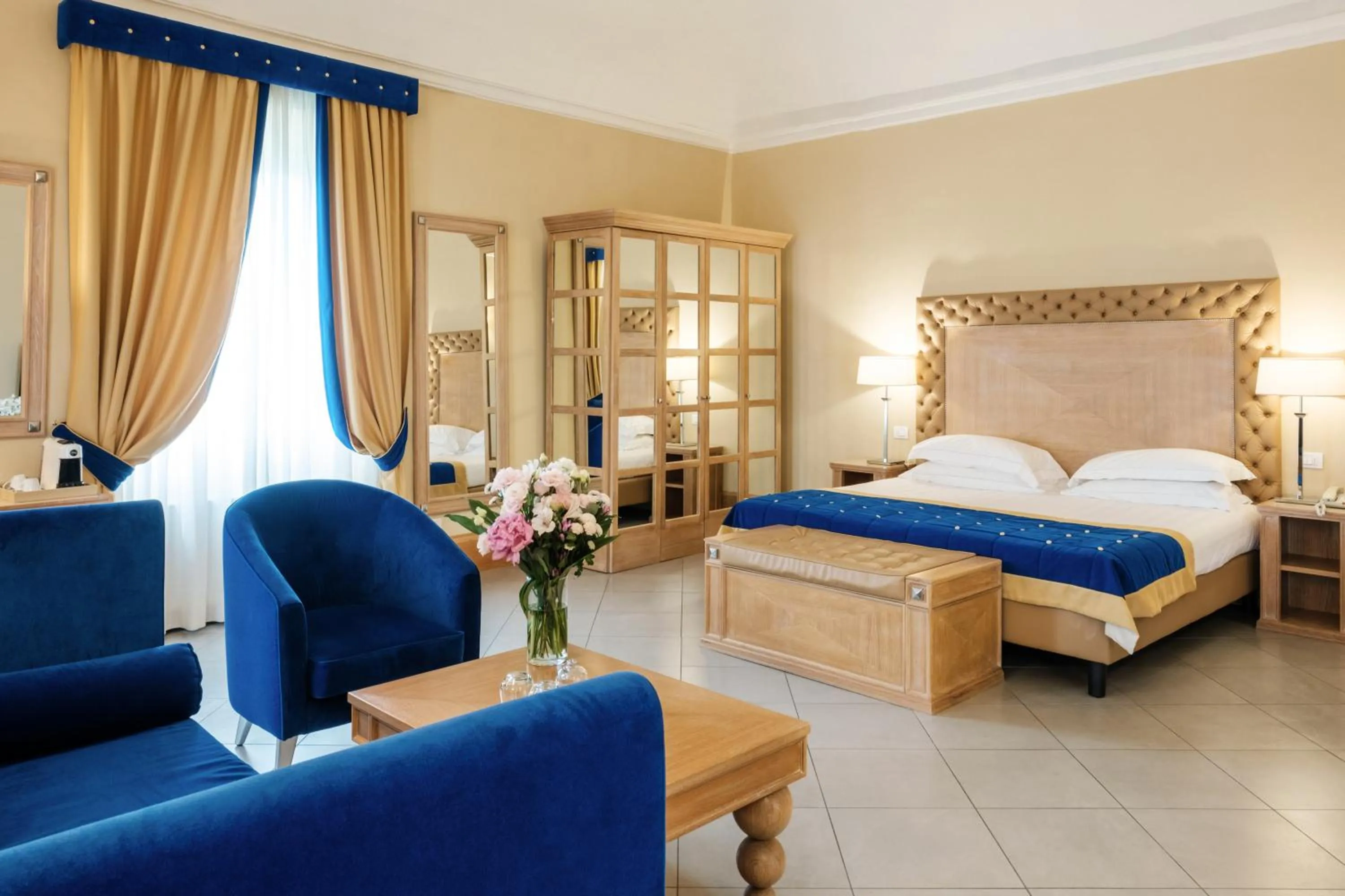 Bed in Villa Tolomei Hotel & Resort