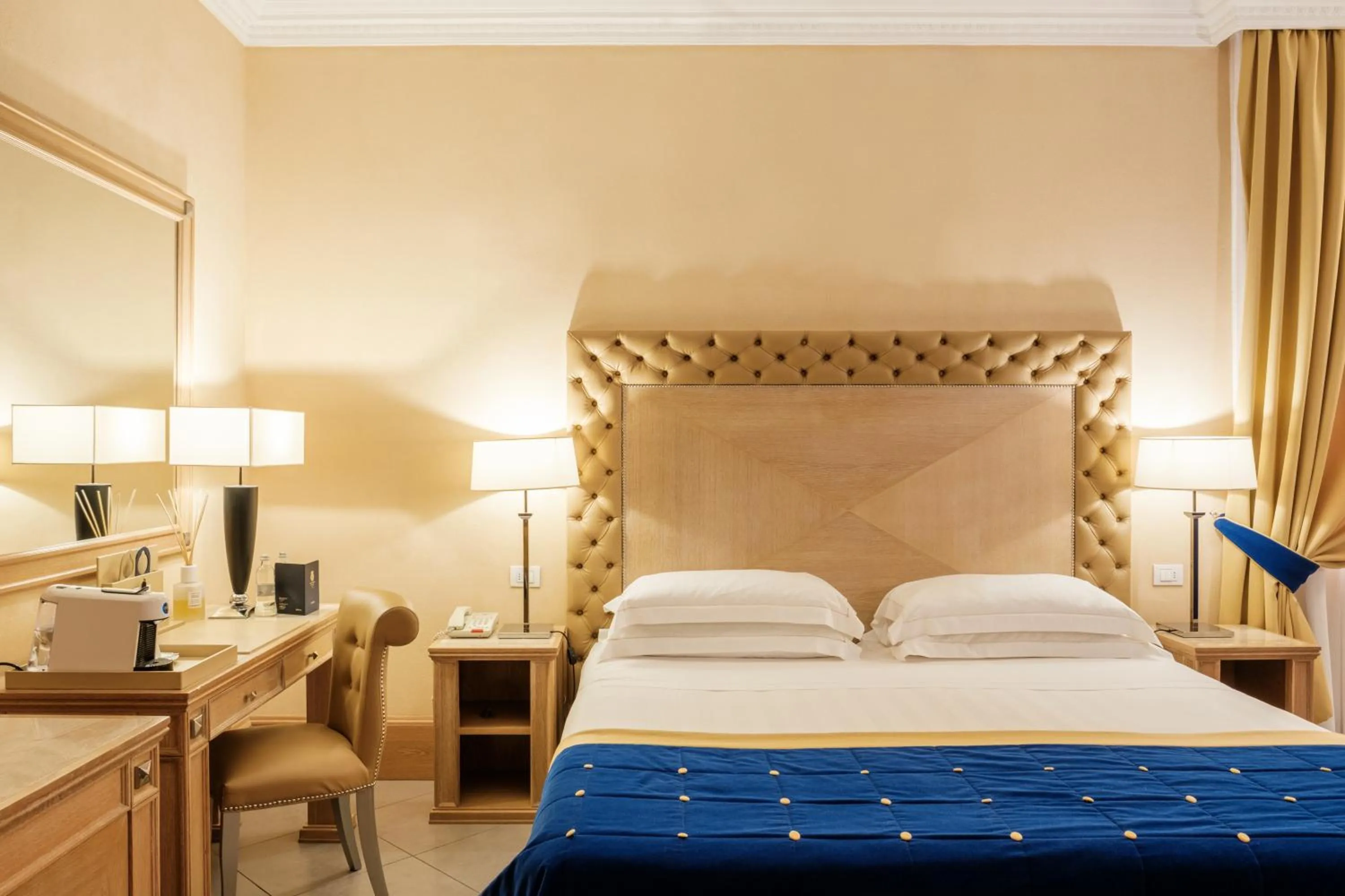 Bed in Villa Tolomei Hotel & Resort