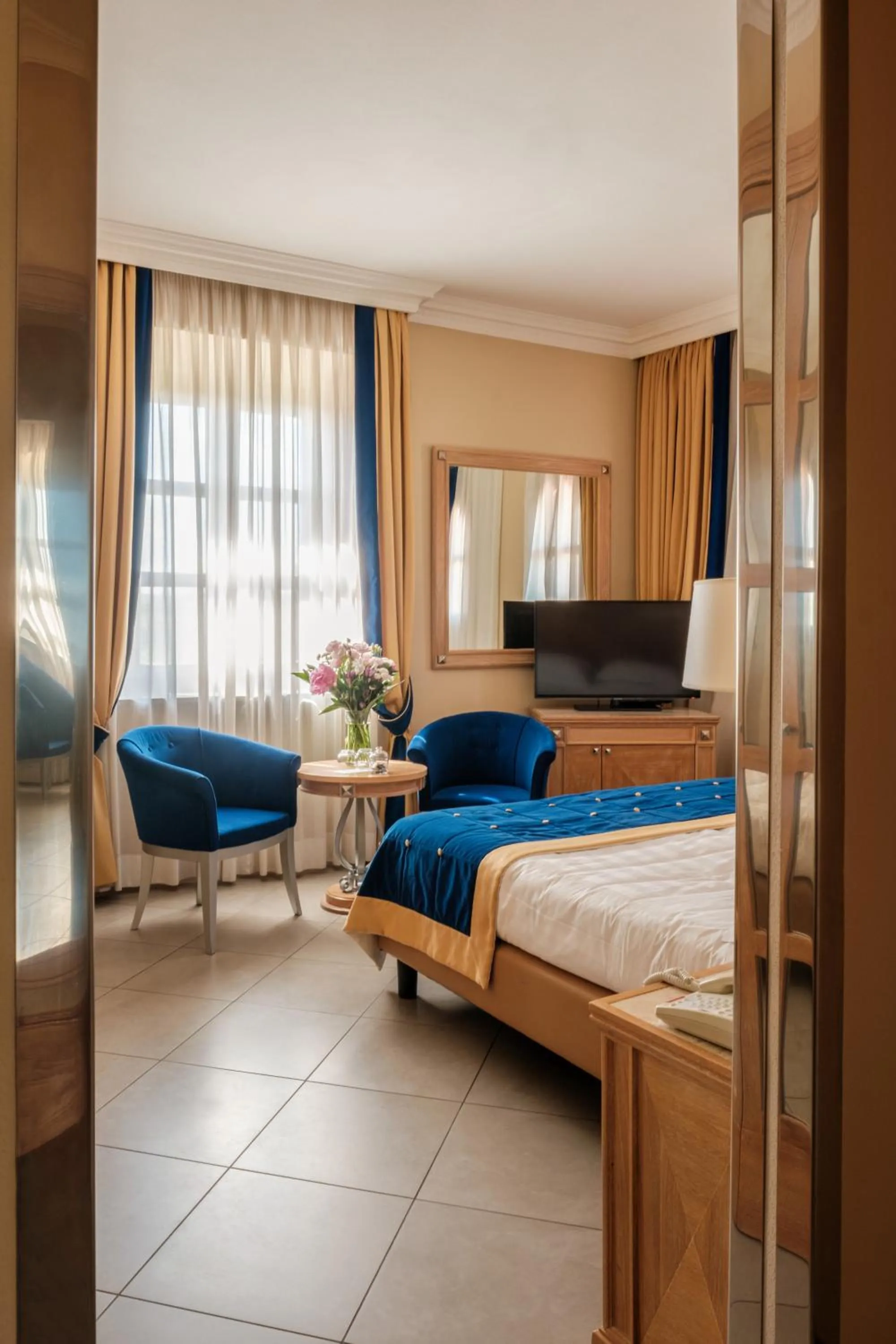 Bed in Villa Tolomei Hotel & Resort