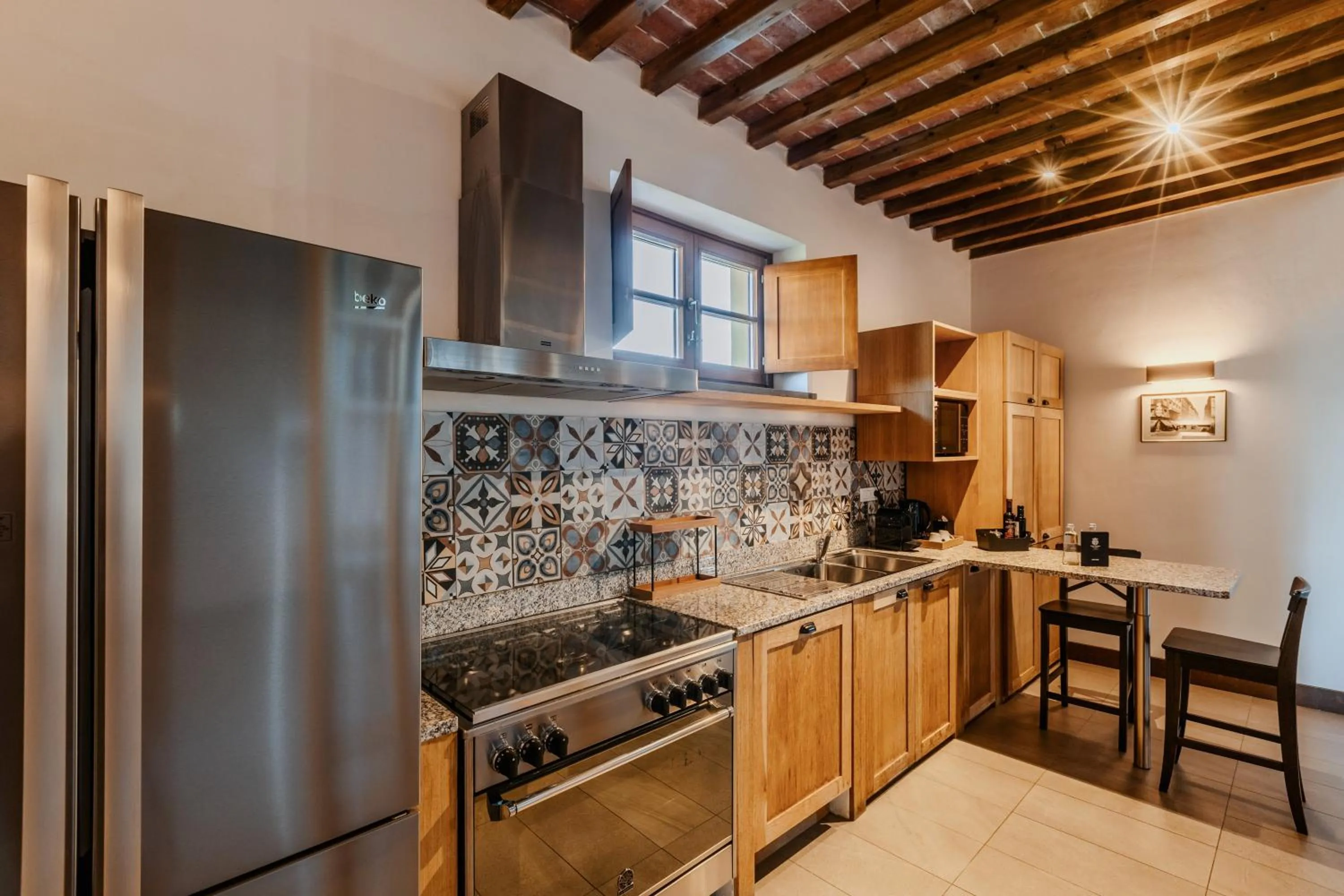 Kitchen or kitchenette in Villa Tolomei Hotel & Resort