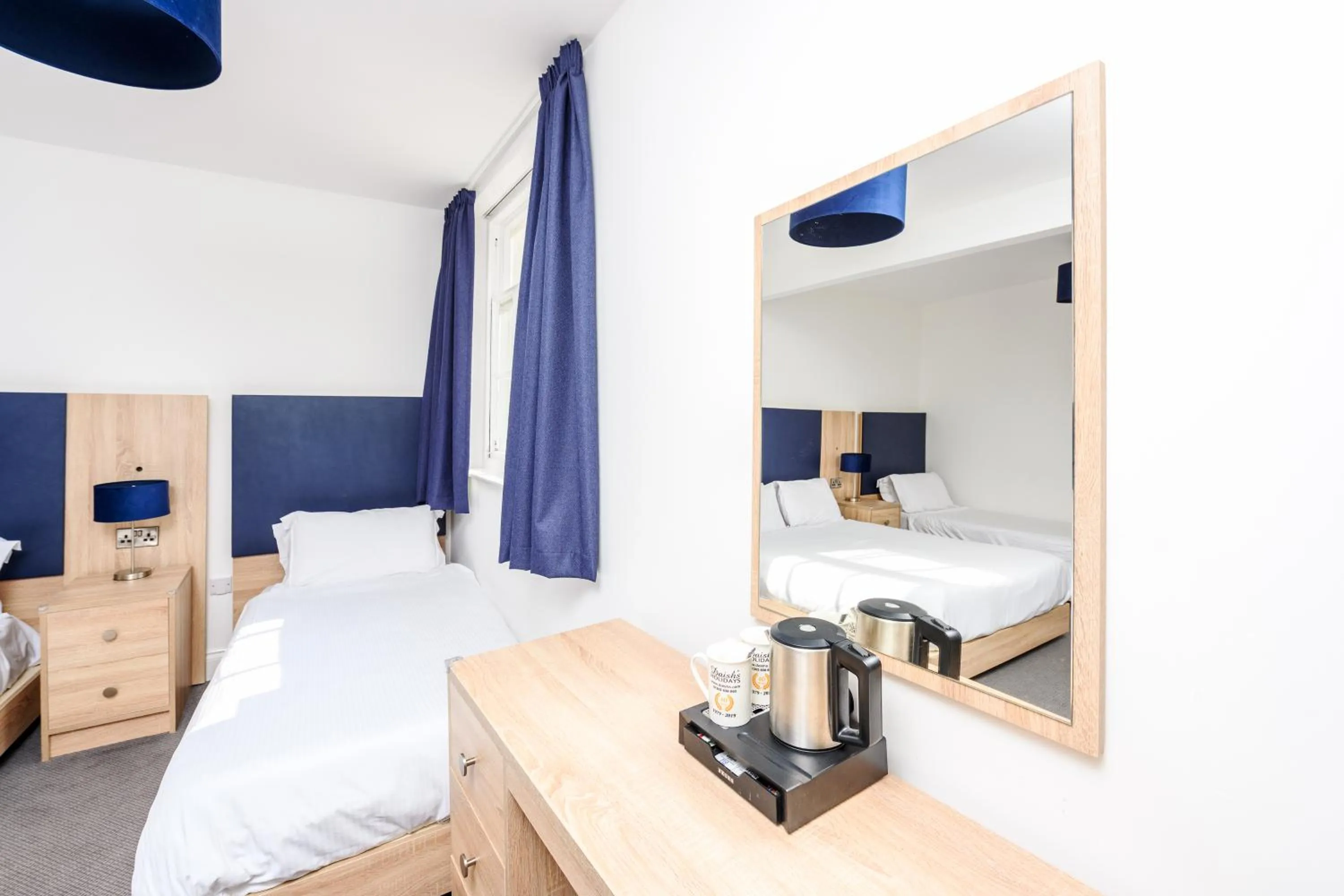 Bed in The Esplanade Hotel