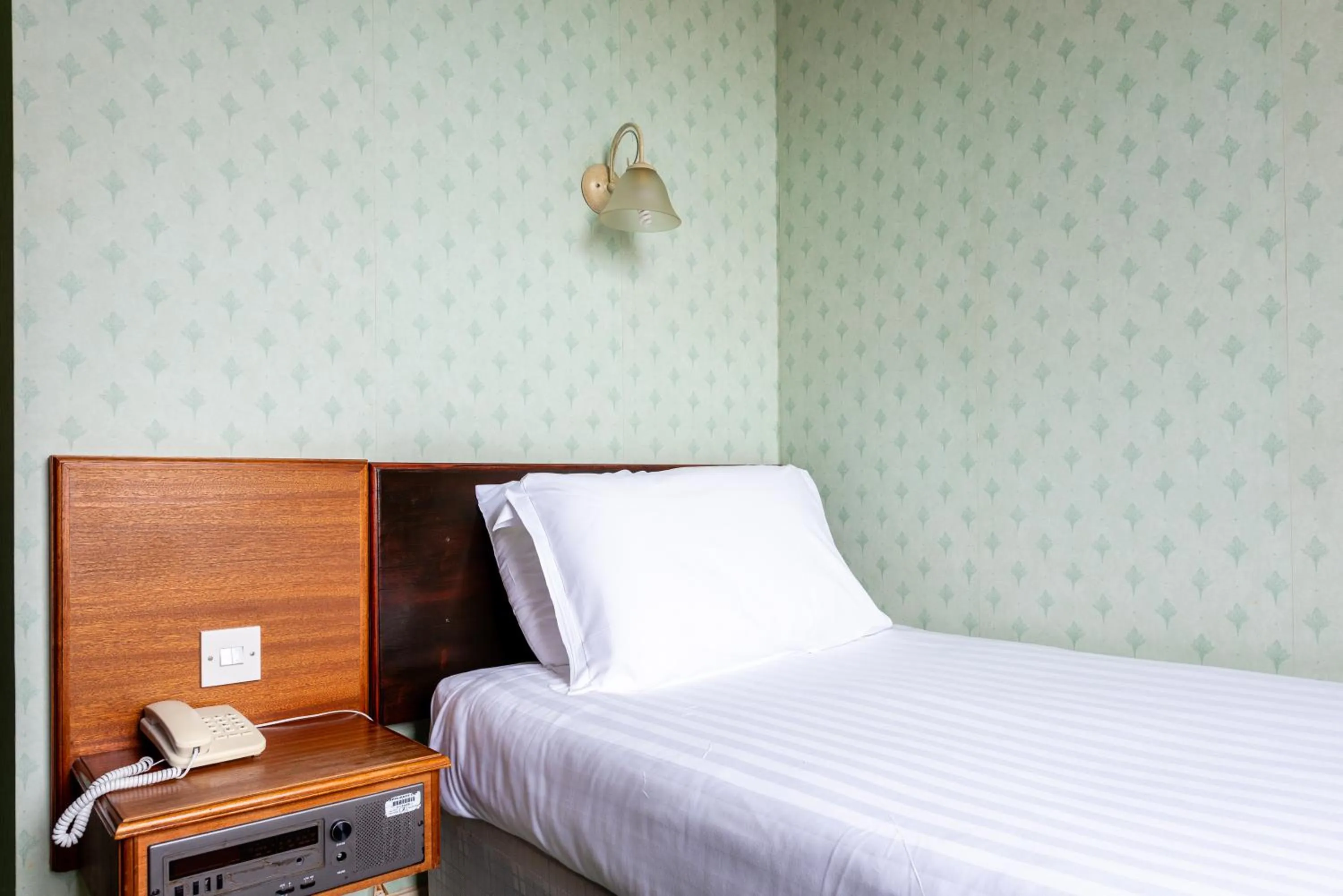 Bed in The Esplanade Hotel