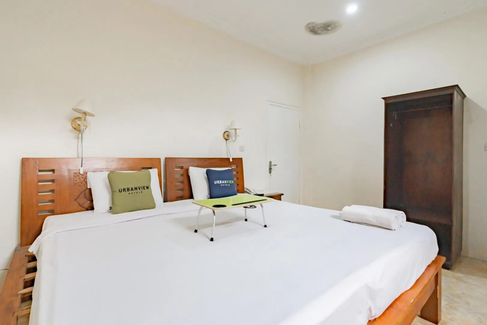 Photo of the whole room, Bed in Urbanview Hotel Mon Bel Cibodas by RedDoorz