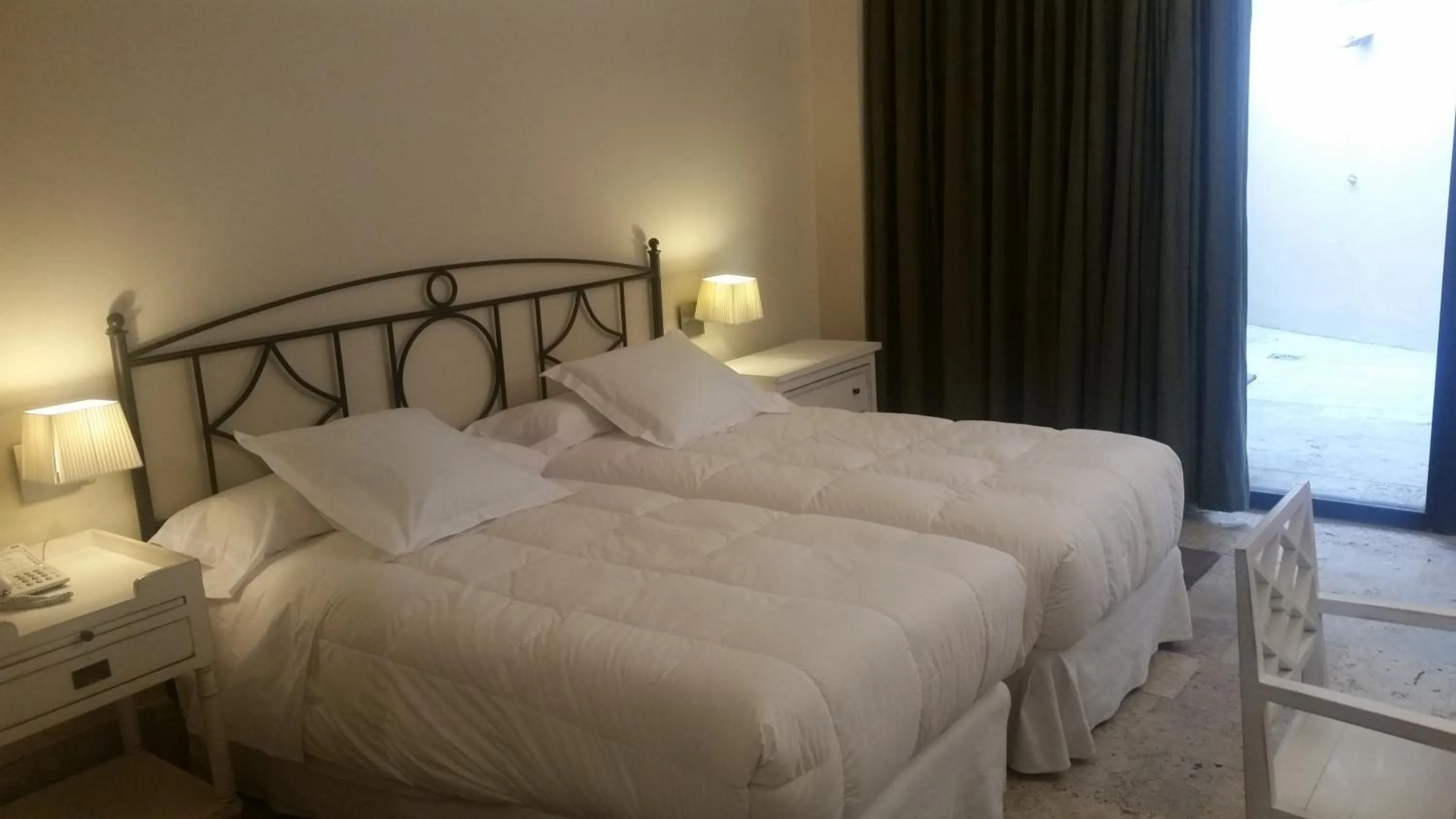 Bed in Hotel Palacio de Mengibar