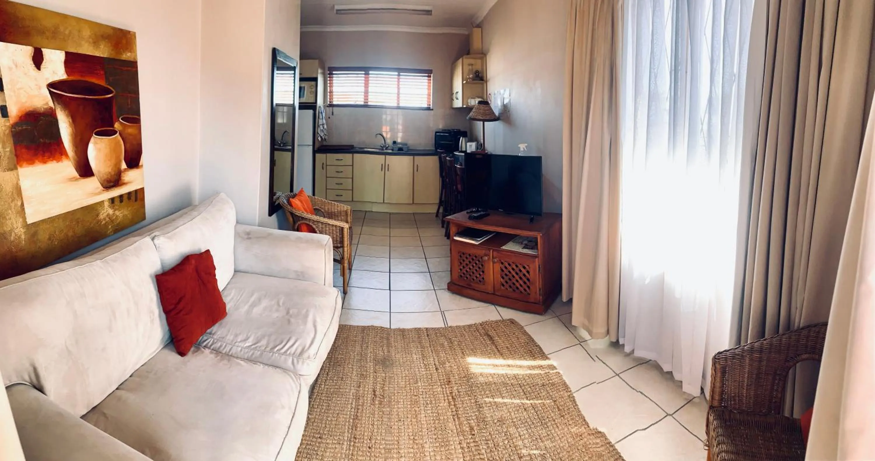 Communal lounge/ TV room in Summerstrand Beach Lodge