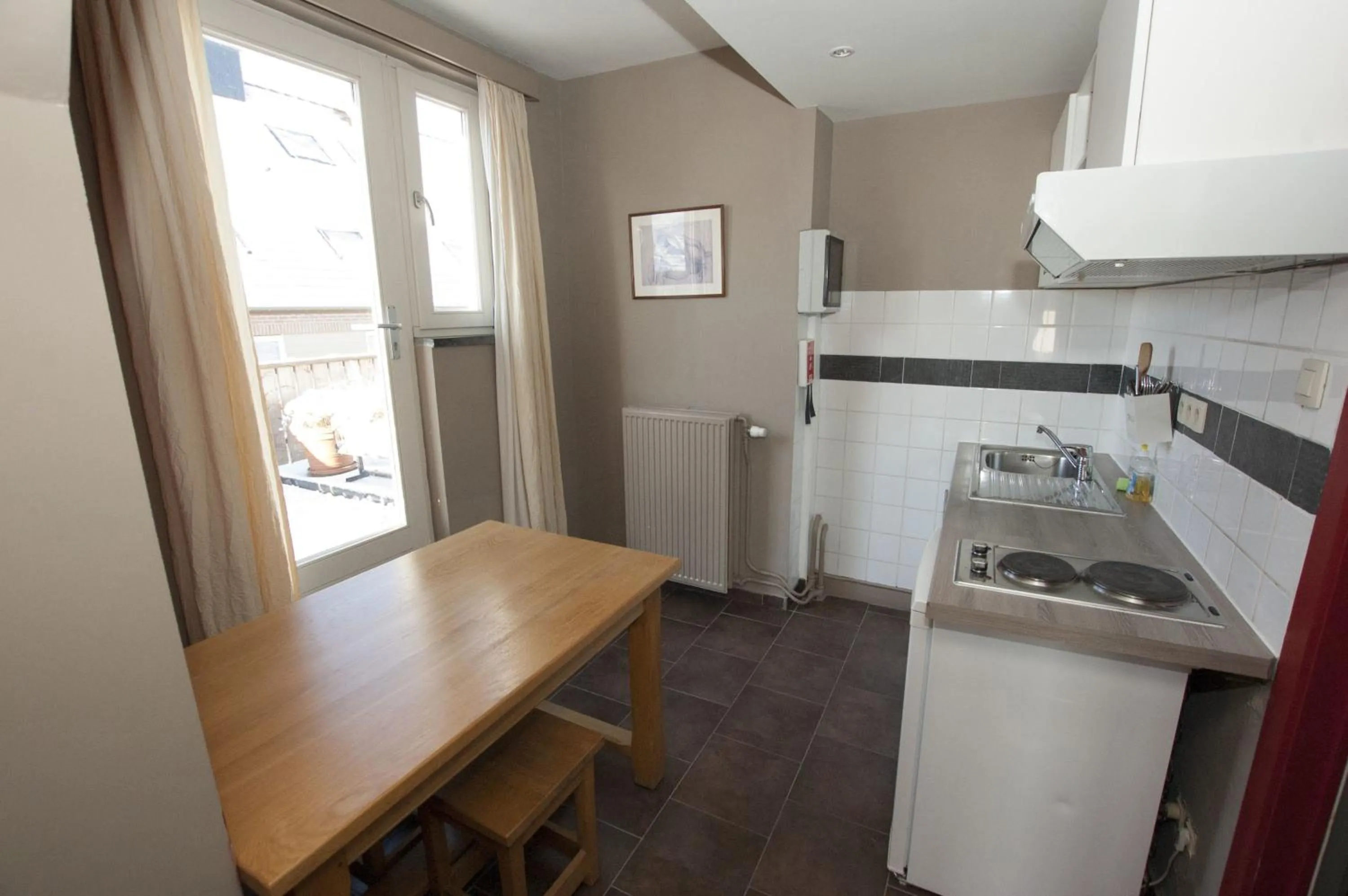 Kitchen or kitchenette in Hotel Piano 2 - Mont-St-Guibert - Louvain-la-Neuve