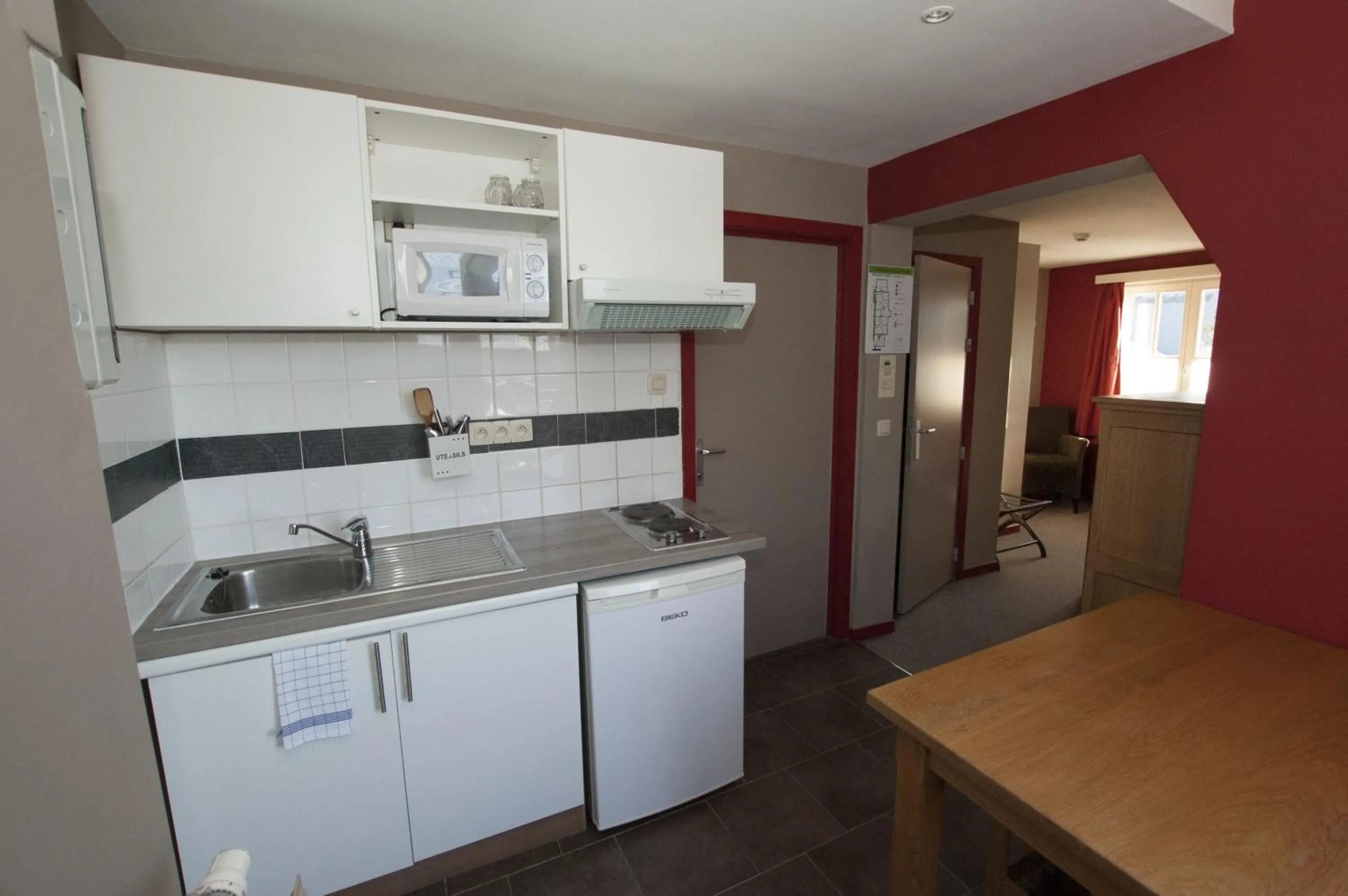 Kitchen or kitchenette in Hotel Piano 2 - Mont-St-Guibert - Louvain-la-Neuve
