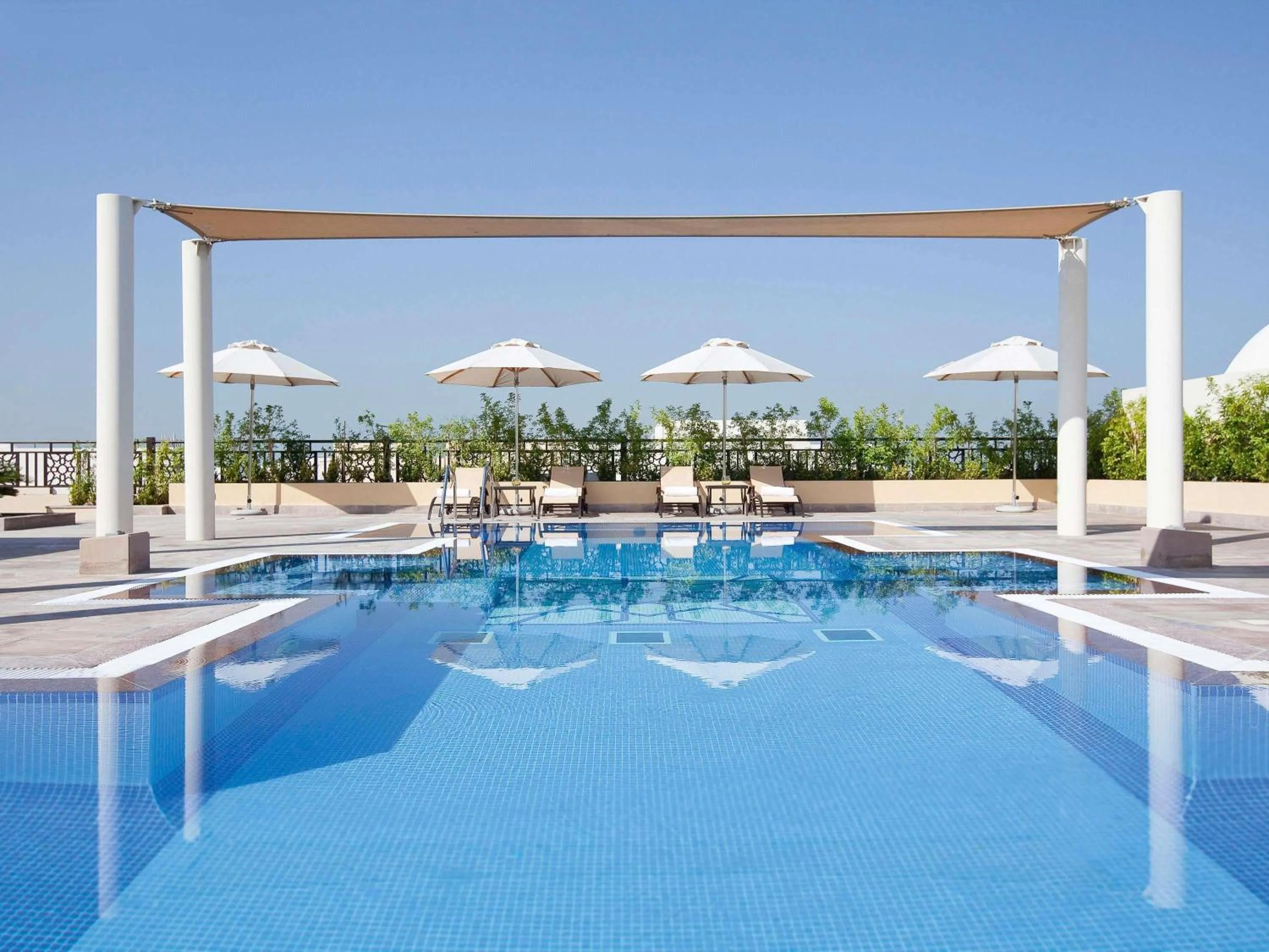 Pool view in Mövenpick Hotel Apartments Al Mamzar Dubai