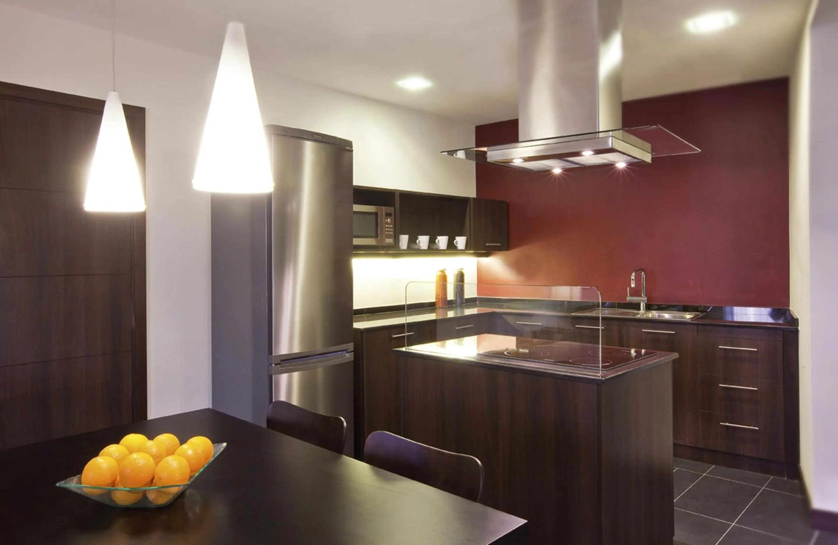 Kitchen or kitchenette in Mövenpick Hotel Apartments Al Mamzar Dubai